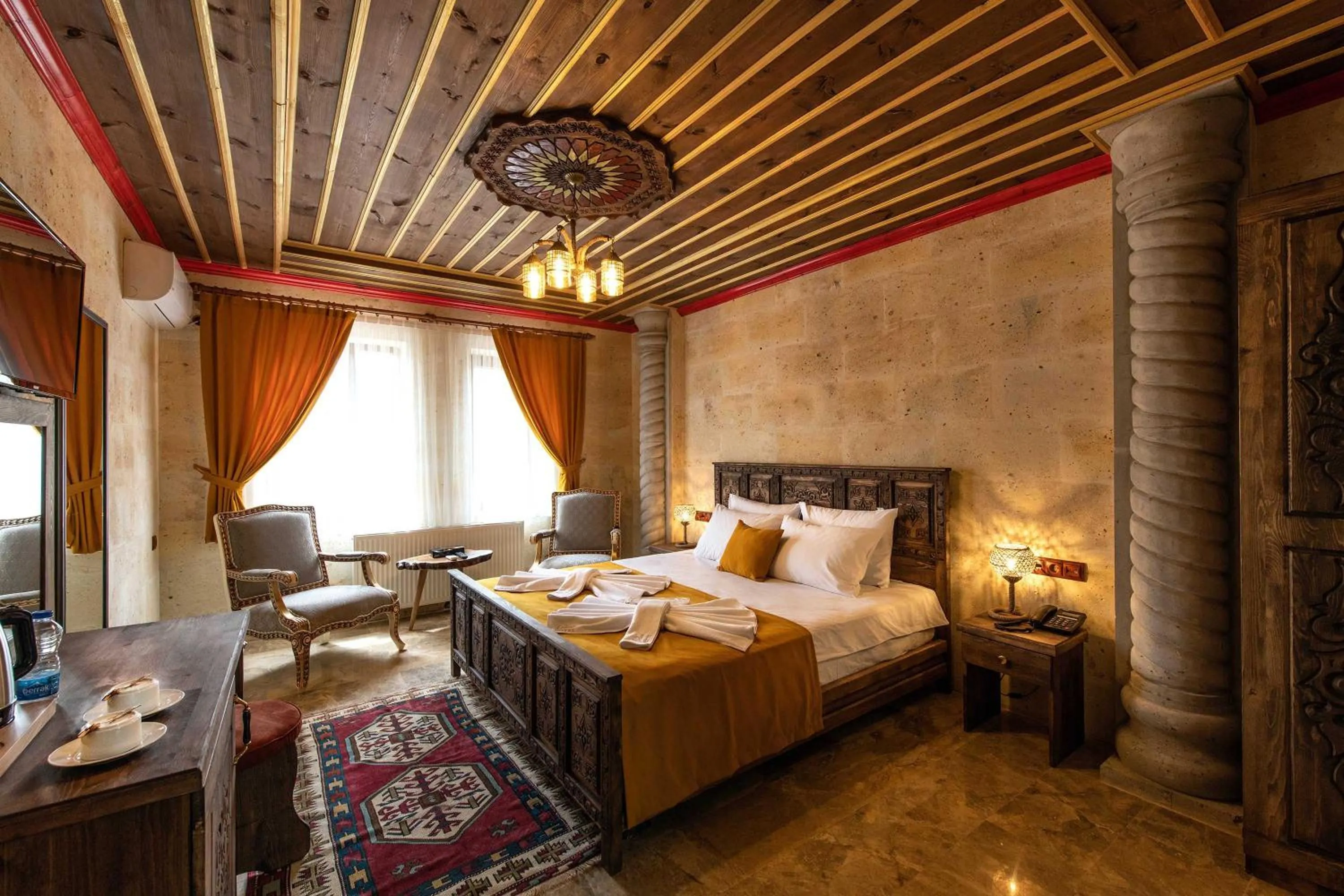 Bed in Volare Stone Hotel