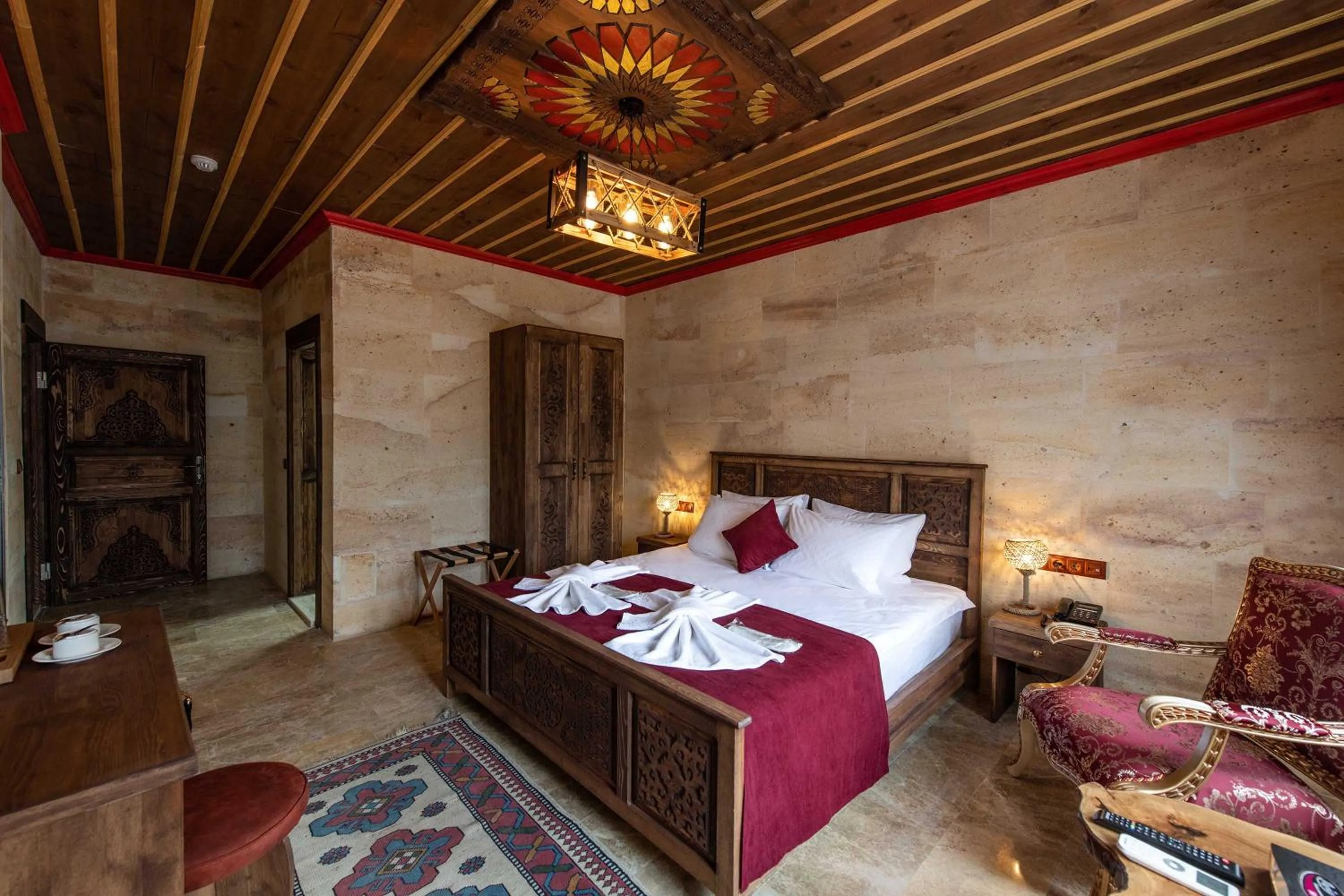 Bed in Volare Stone Hotel