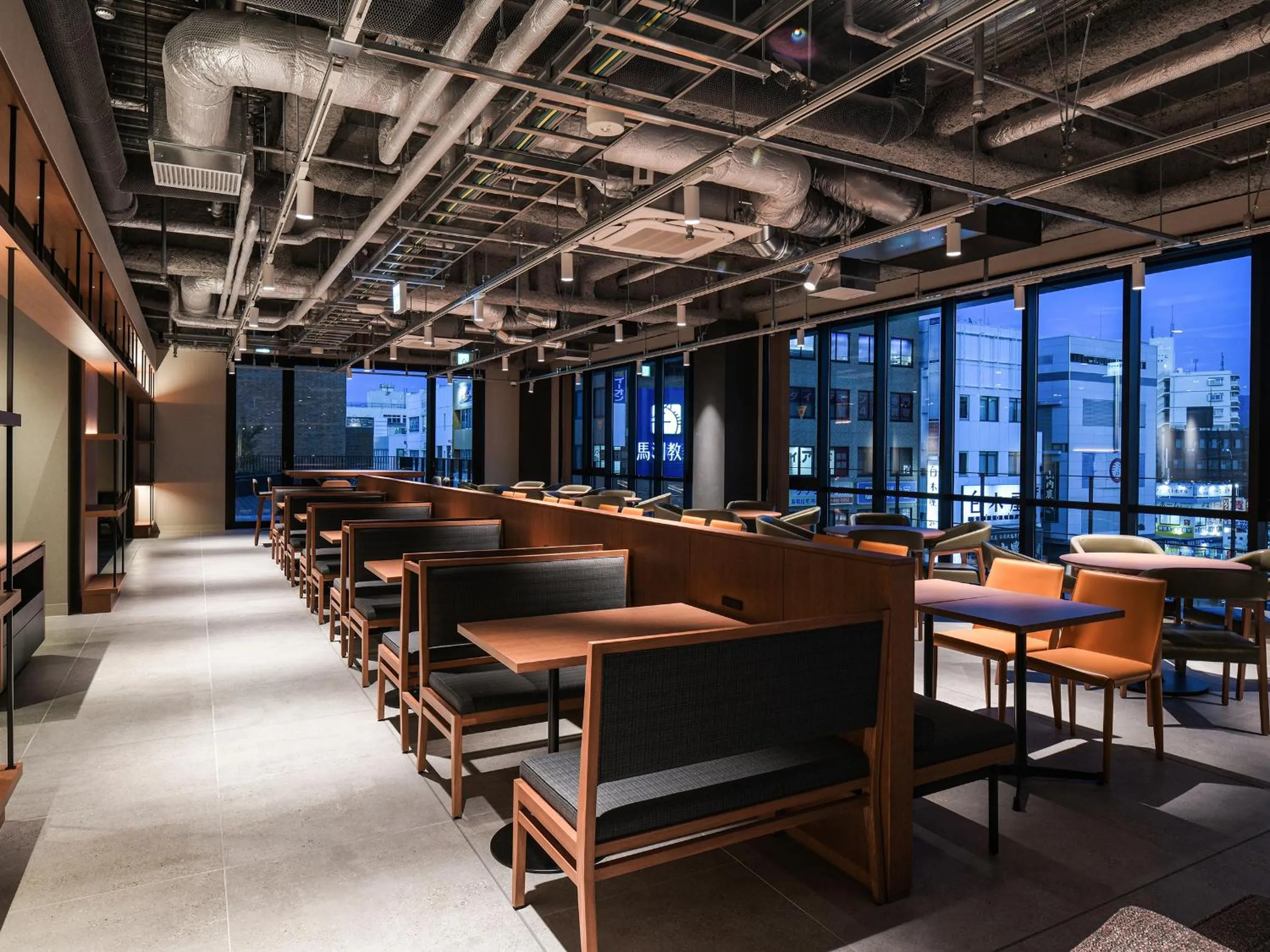 Communal lounge/ TV room in REF Kansai Airport by VESSEL HOTELS