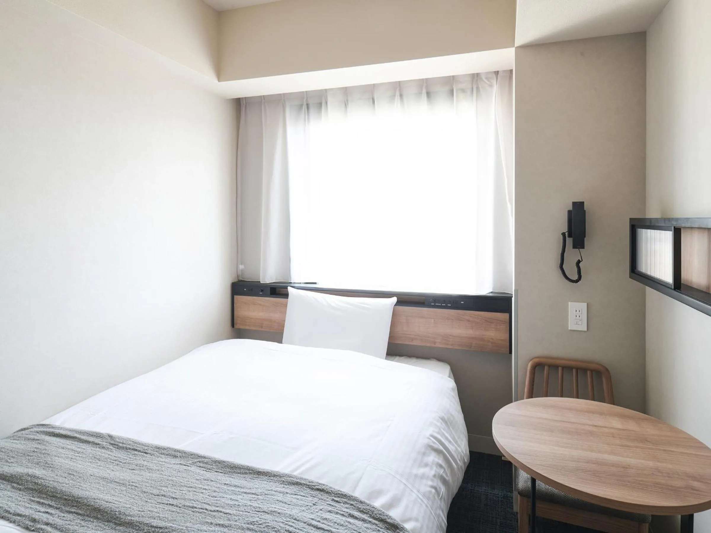 Bed in REF Kansai Airport by VESSEL HOTELS