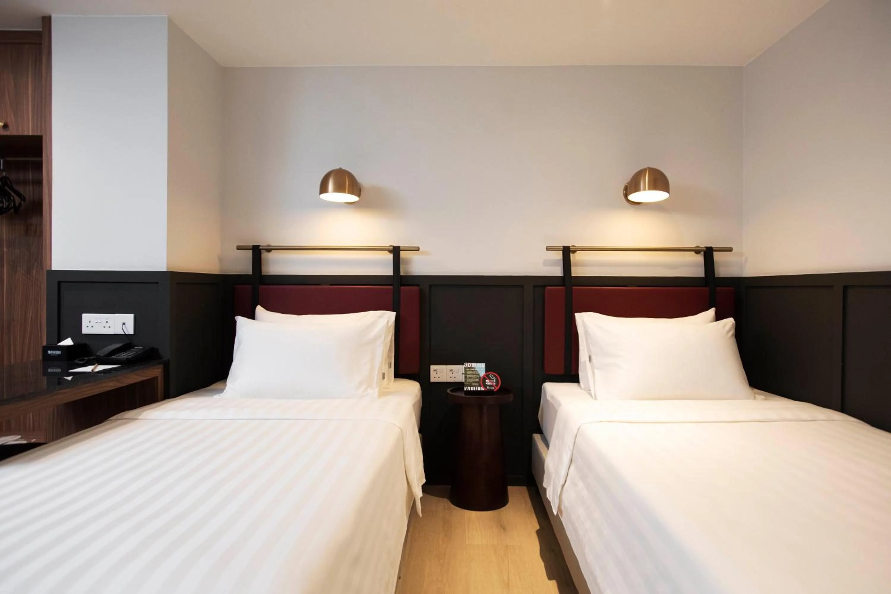 Bed in Monocolo Boutique Hotel