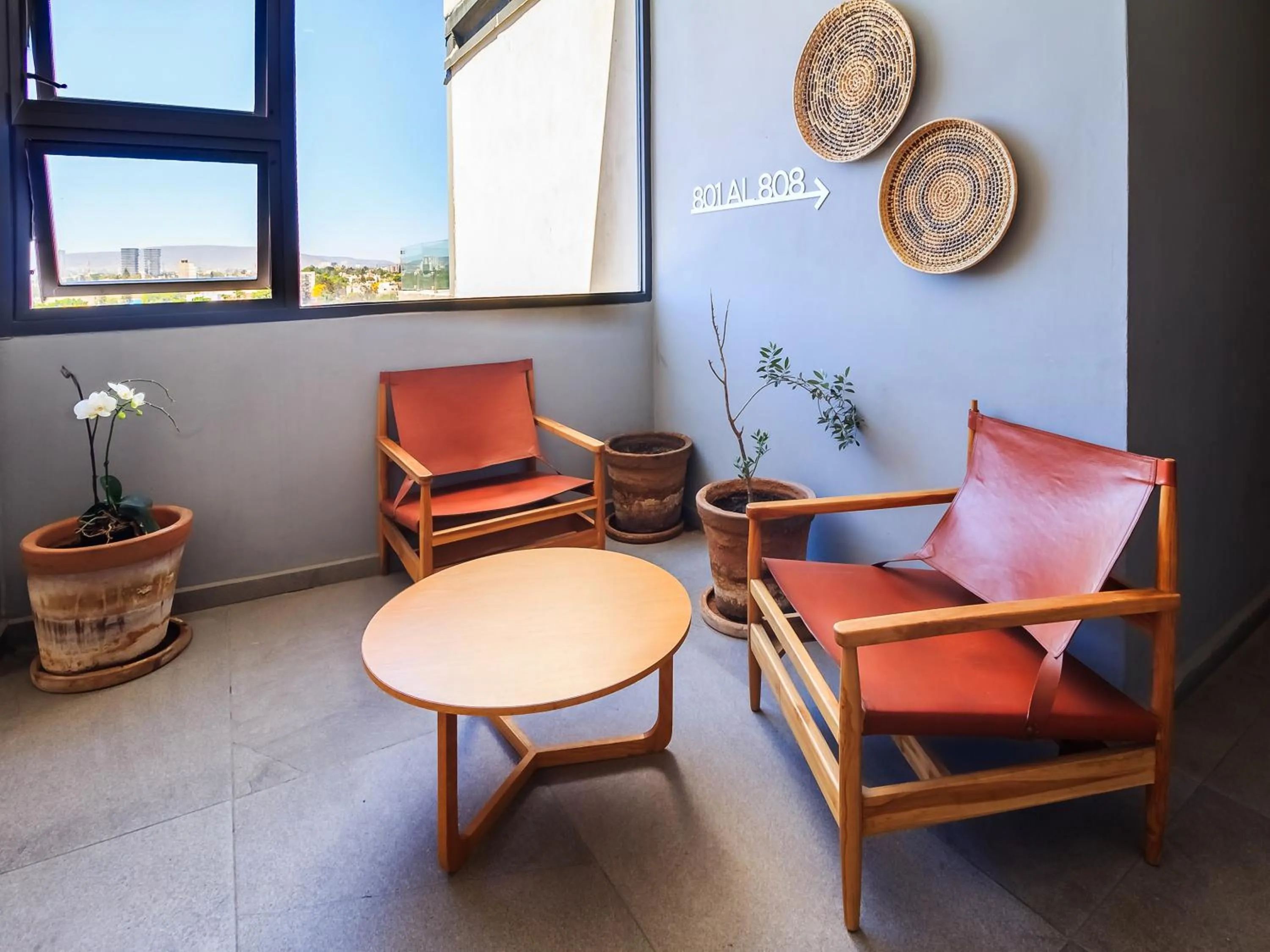 Seating area in Tribu Sonata with pool