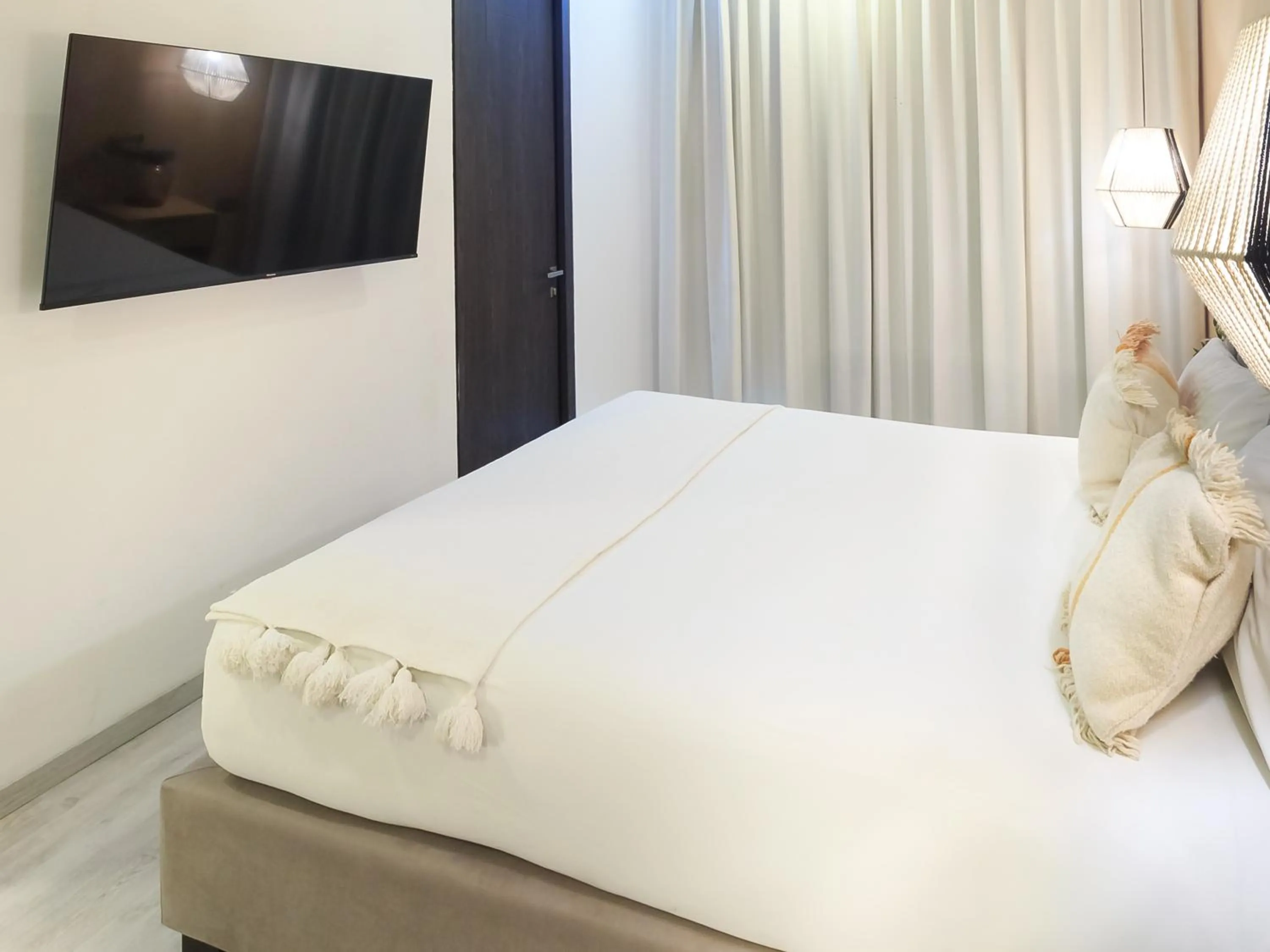 Bed in Tribu Sonata with pool