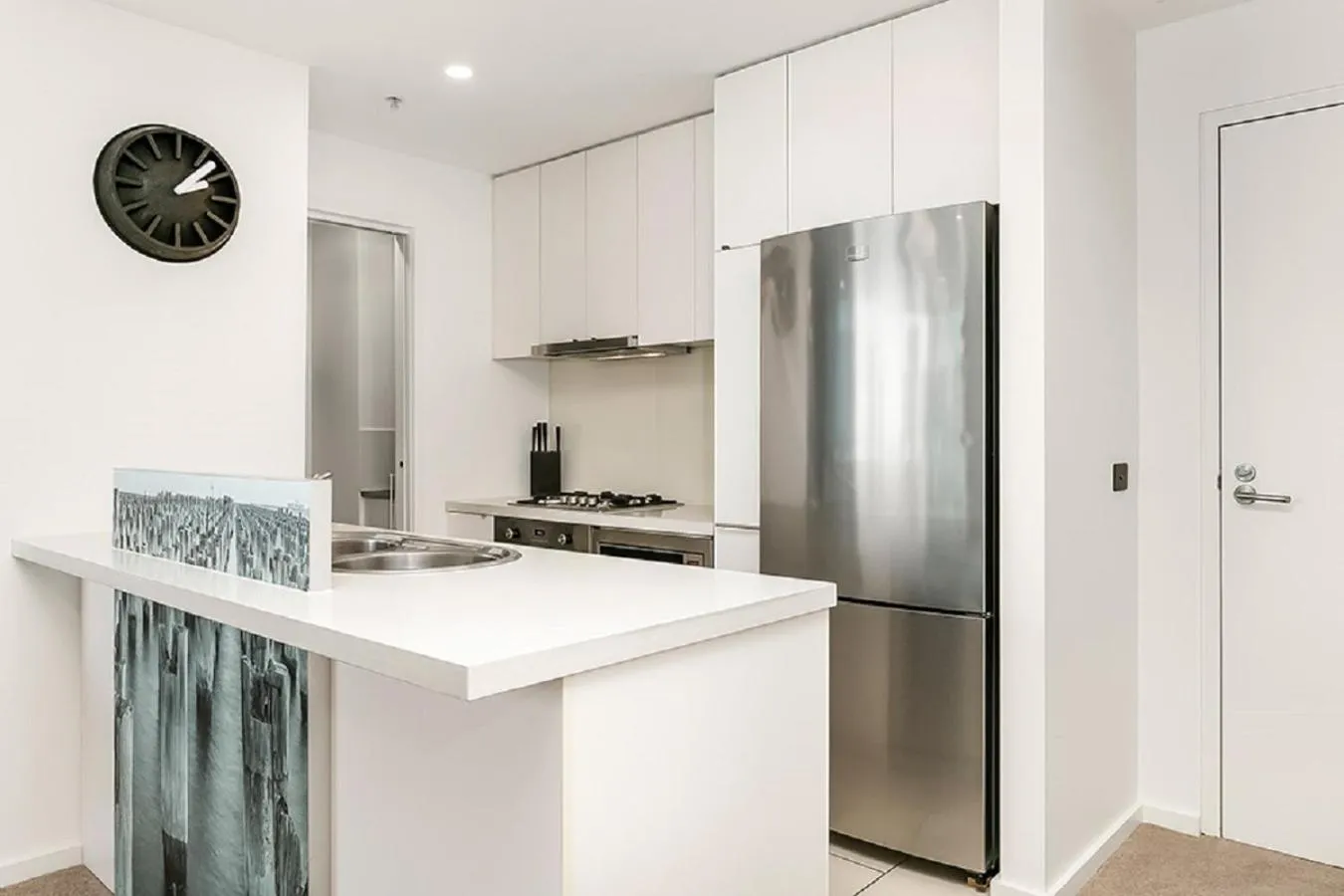 Kitchen or kitchenette in Melbourne Holiday Apartments Flinders Wharf