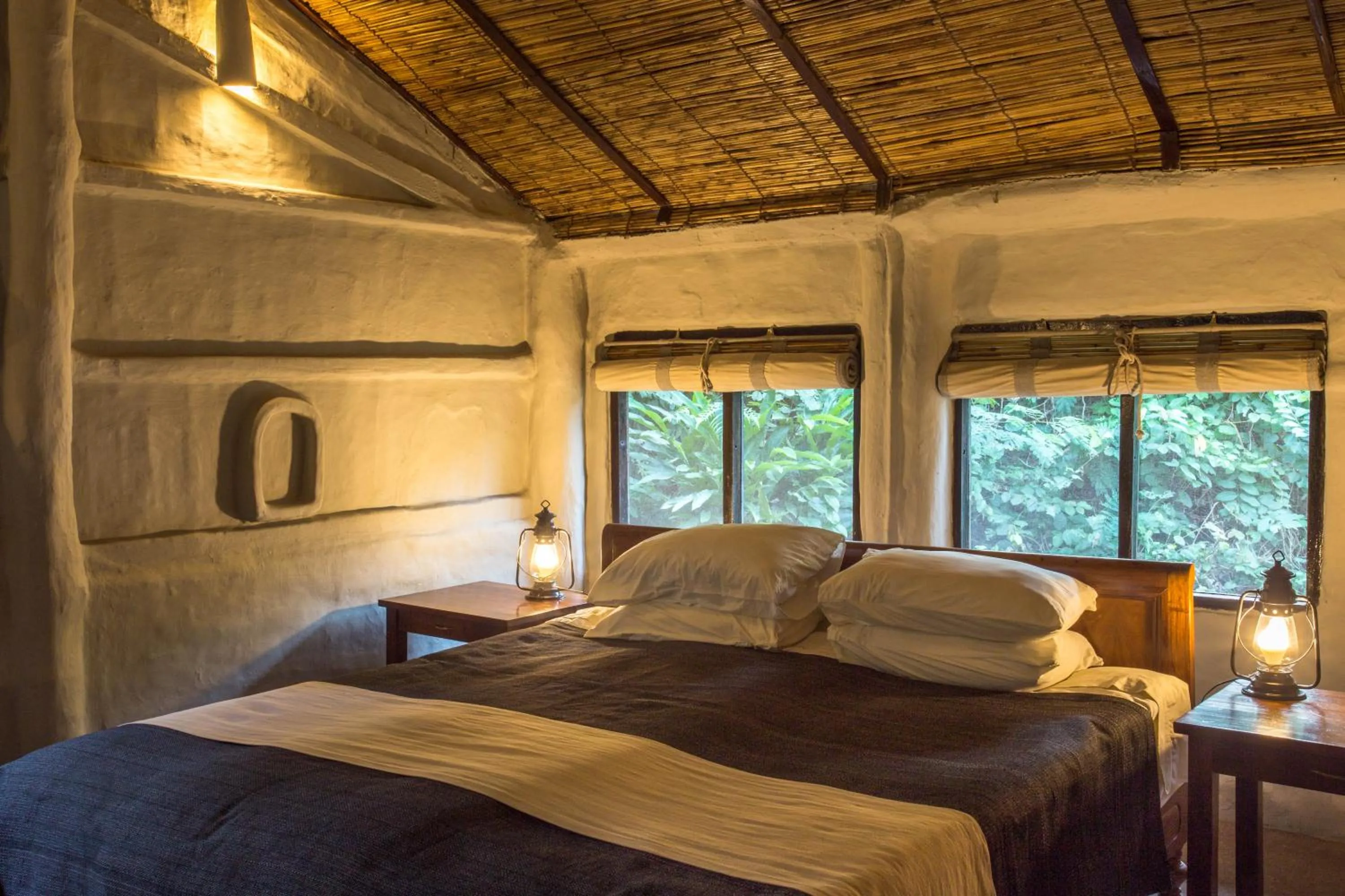 Bed in Tiger Tops Tharu Lodge