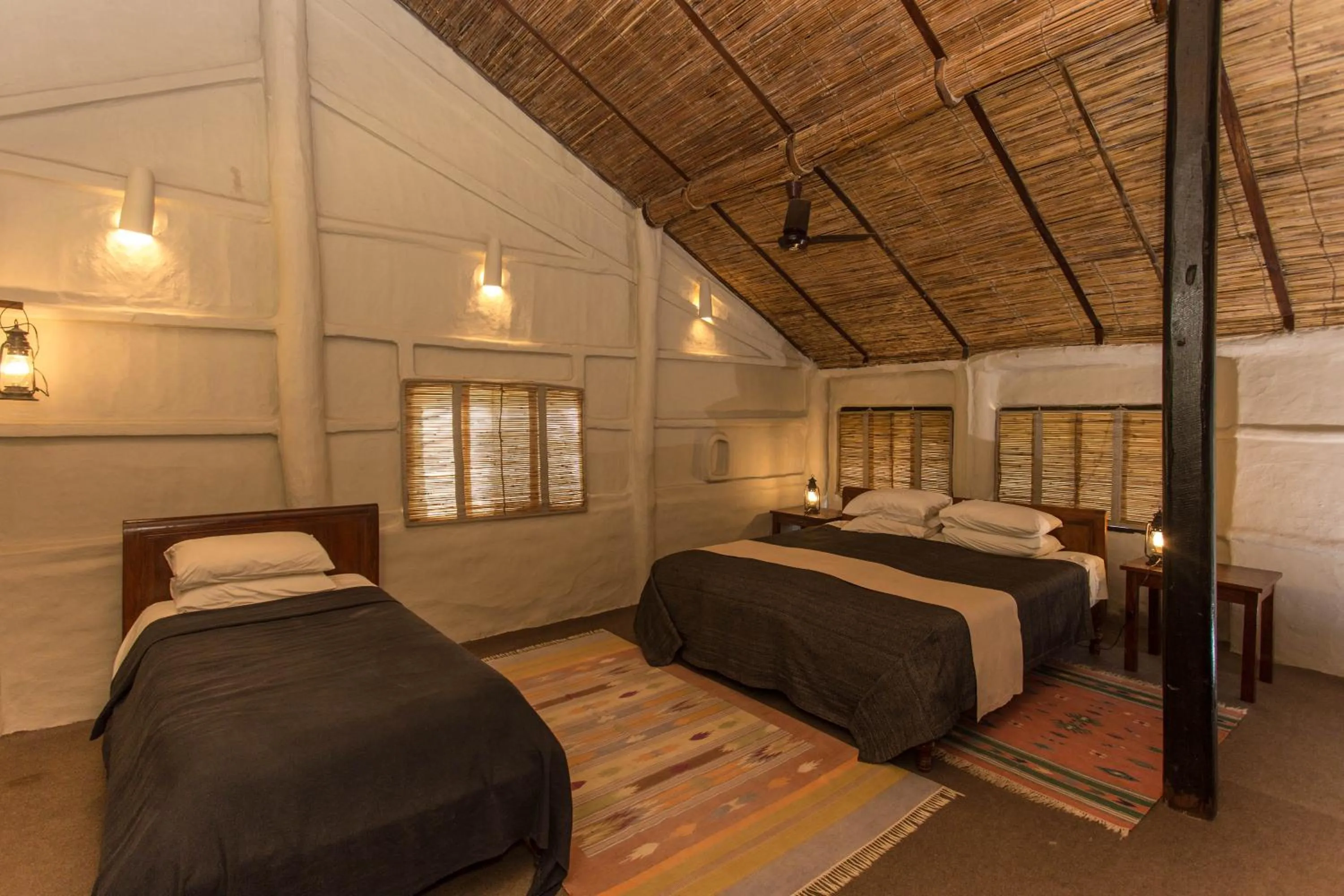 Bed in Tiger Tops Tharu Lodge