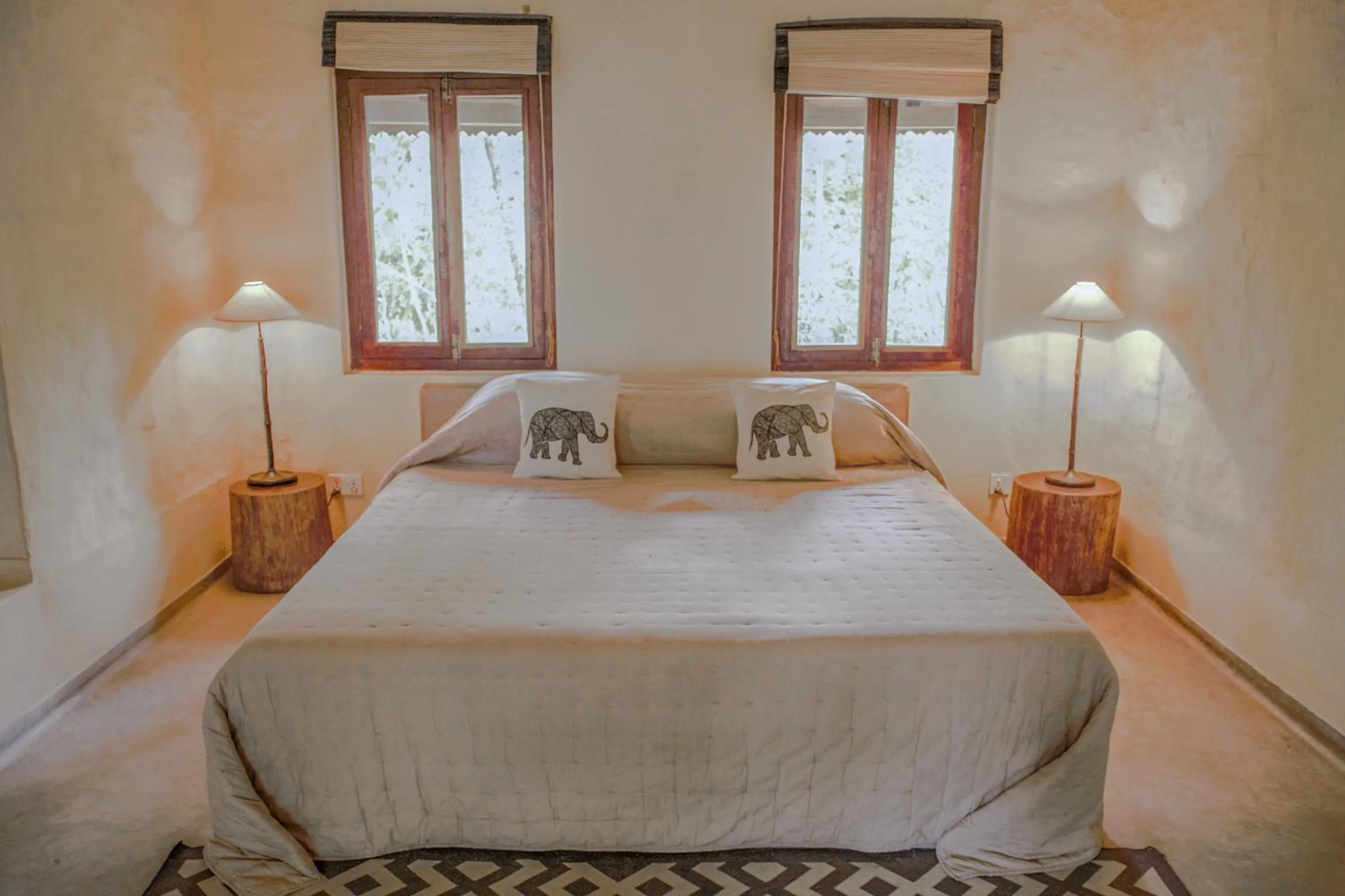 Bed in Tiger Tops Karnali Lodge