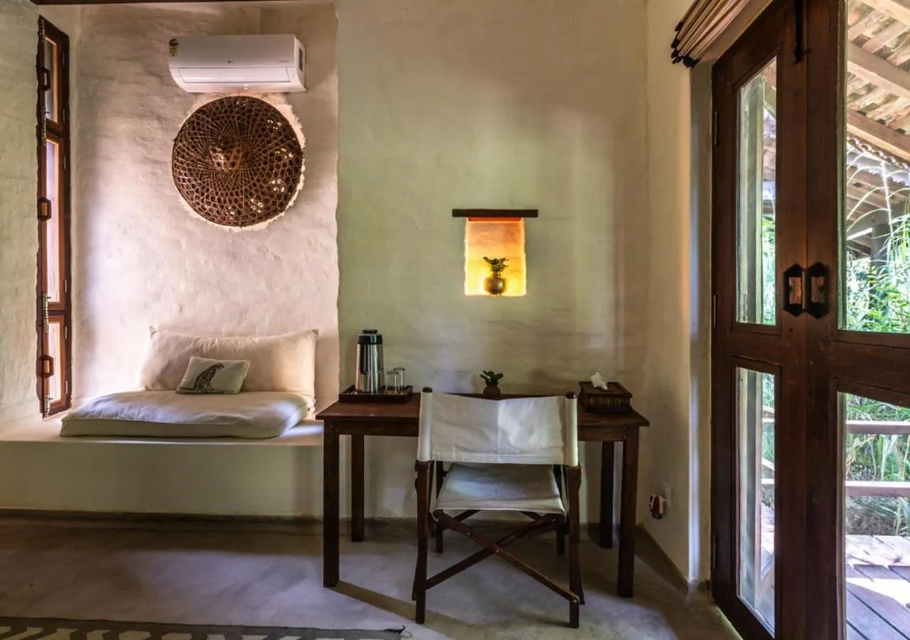 Bed in Tiger Tops Karnali Lodge