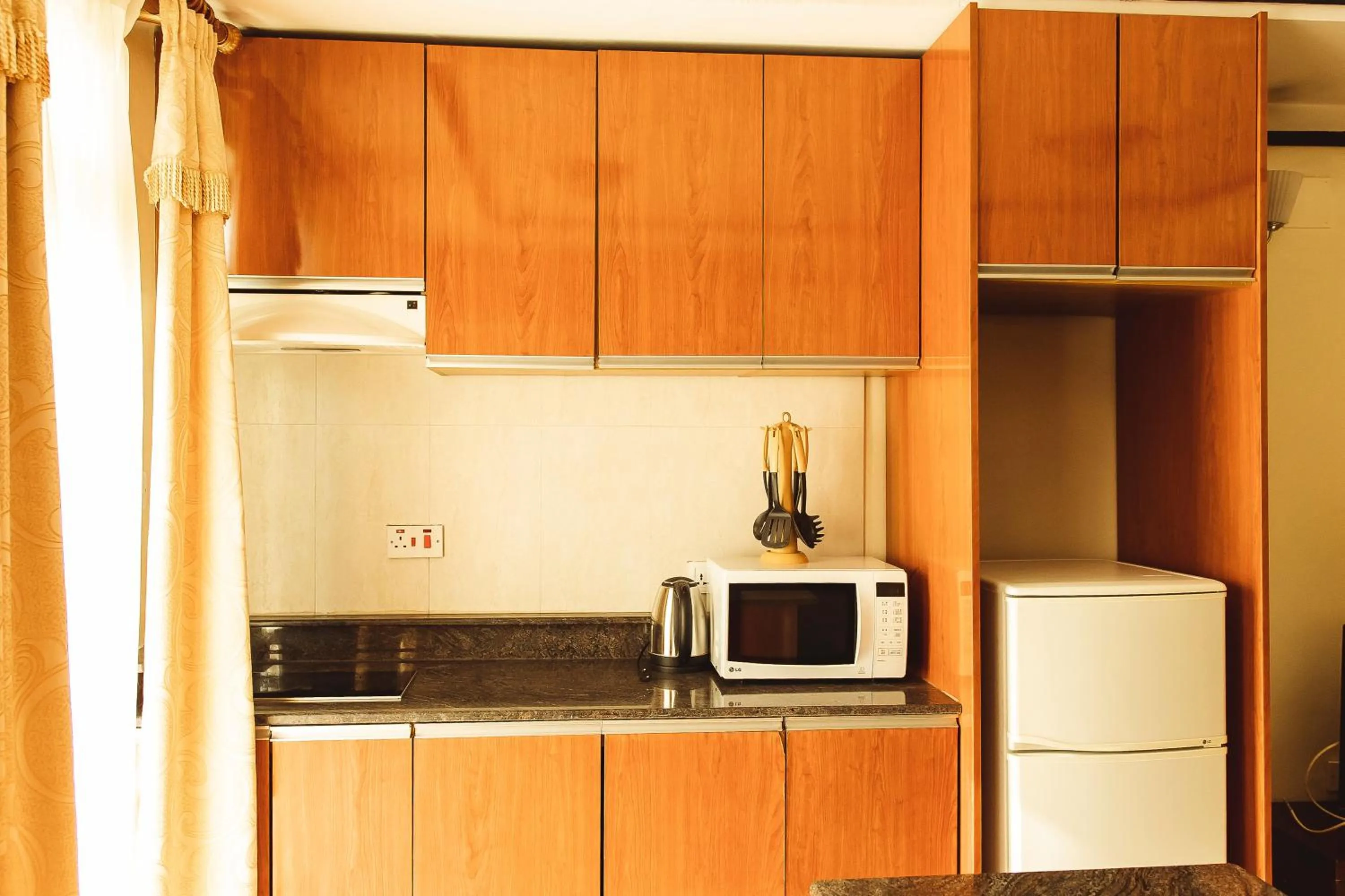 Kitchen or kitchenette in Highlands Suites Hotel and Apartments