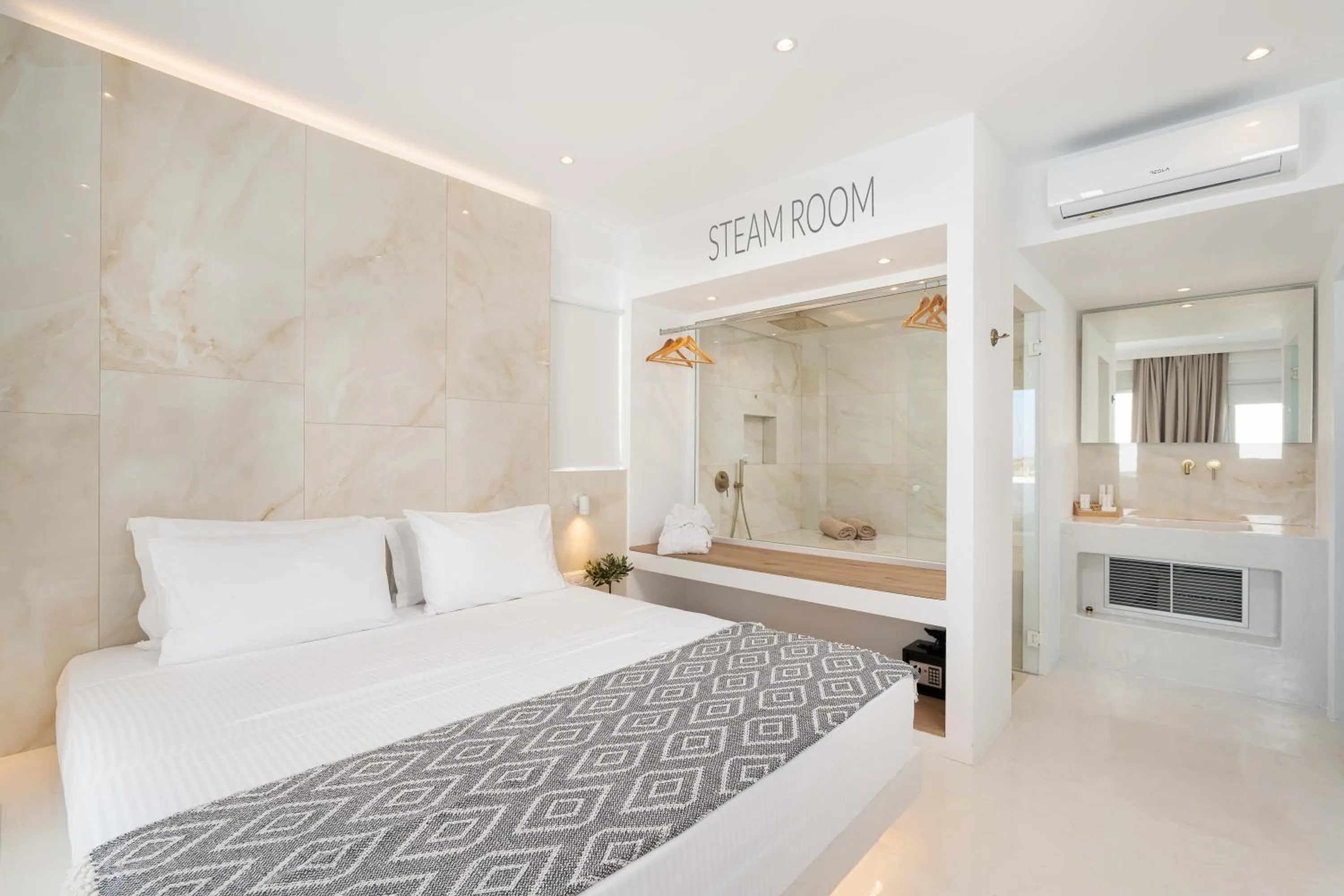 Bed in Cycladic Suites & Spa