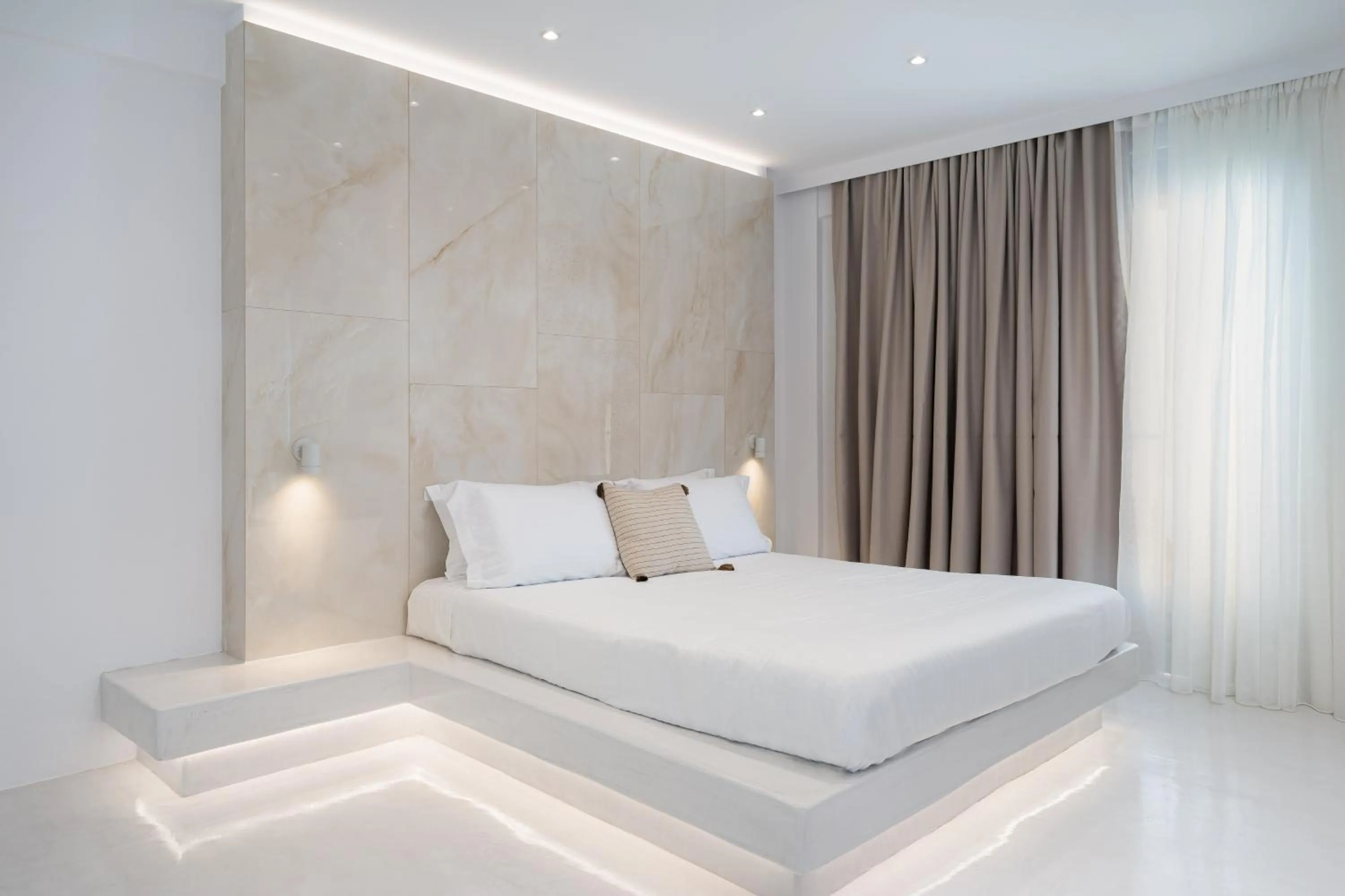 Bed in Cycladic Suites & Spa