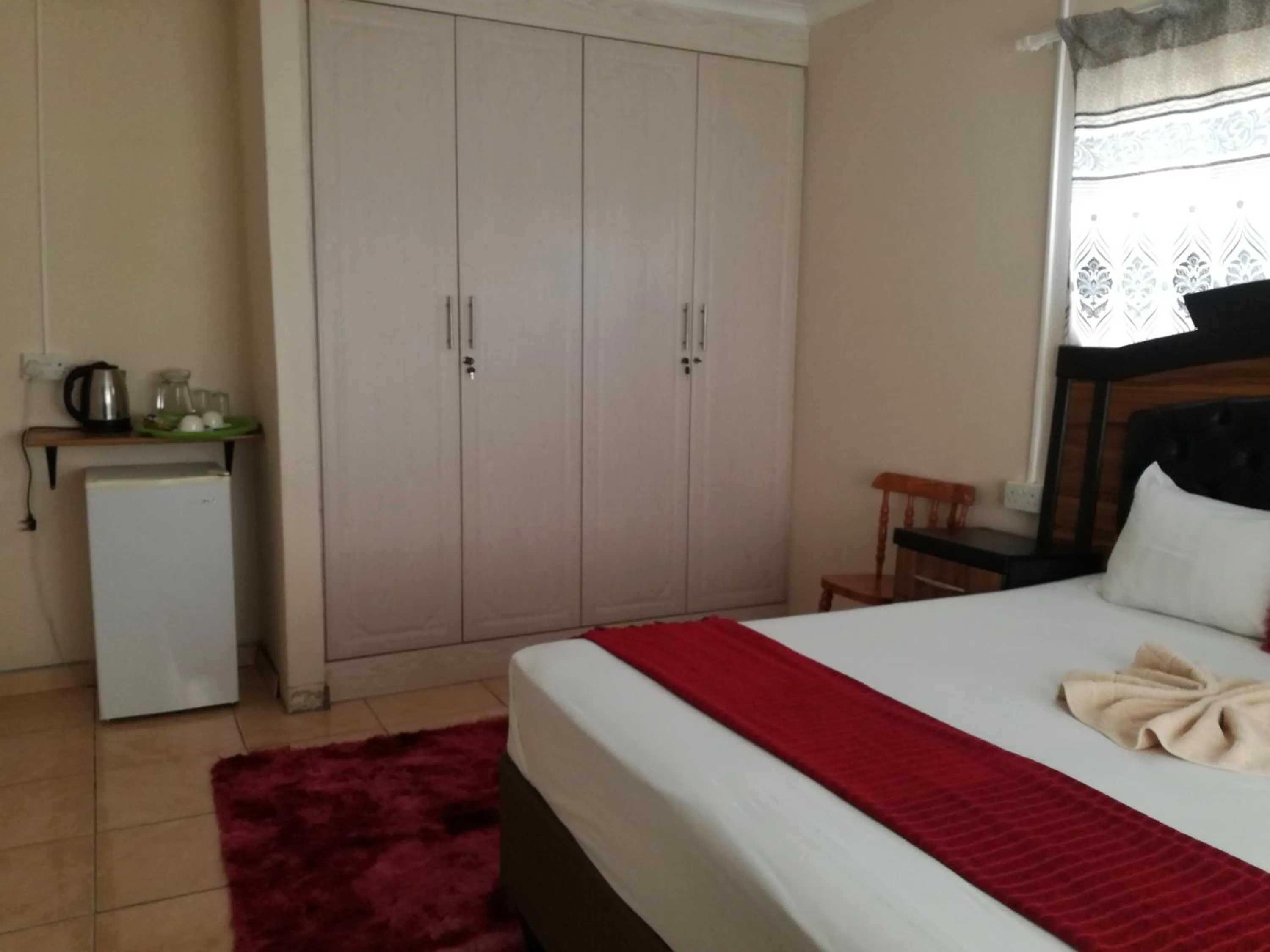 Bed in DEN VIEW GUESTHOUSE