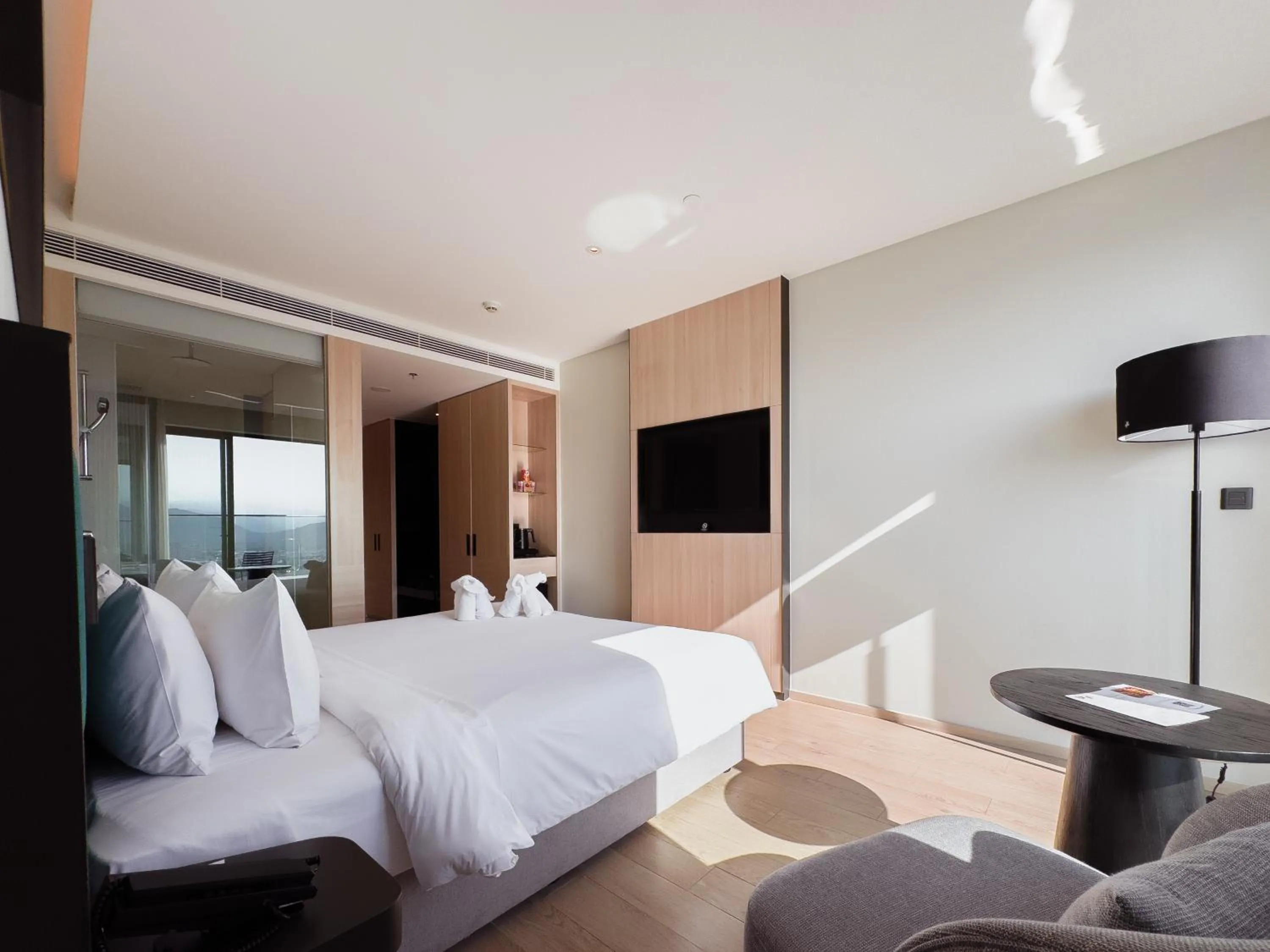 Communal lounge/ TV room, Bed in December Hotel