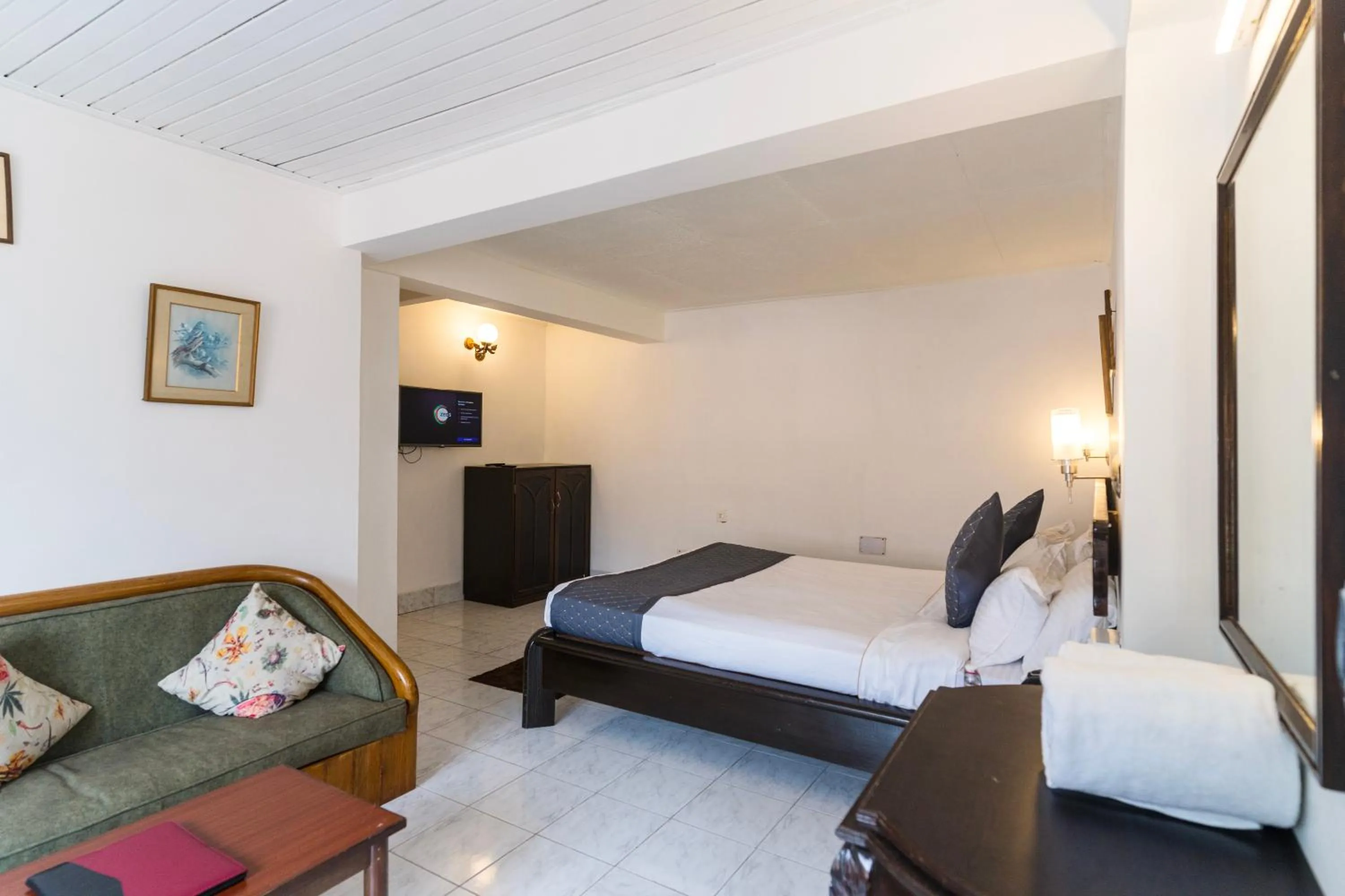 Communal lounge/ TV room, Bed in Sharolyn Boutique Hotel