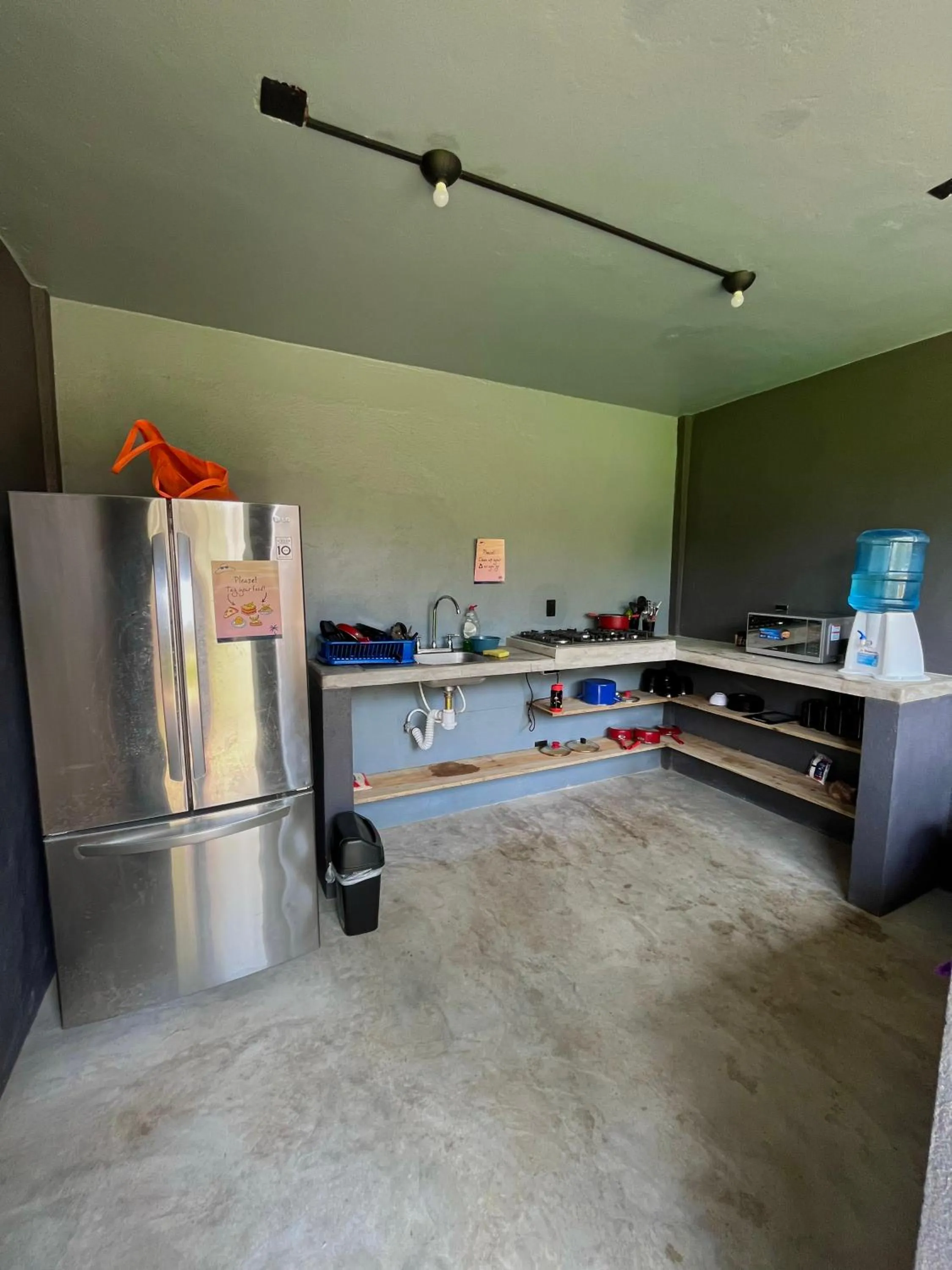 Communal kitchen in Straw Hat Surf Hostel & Bar