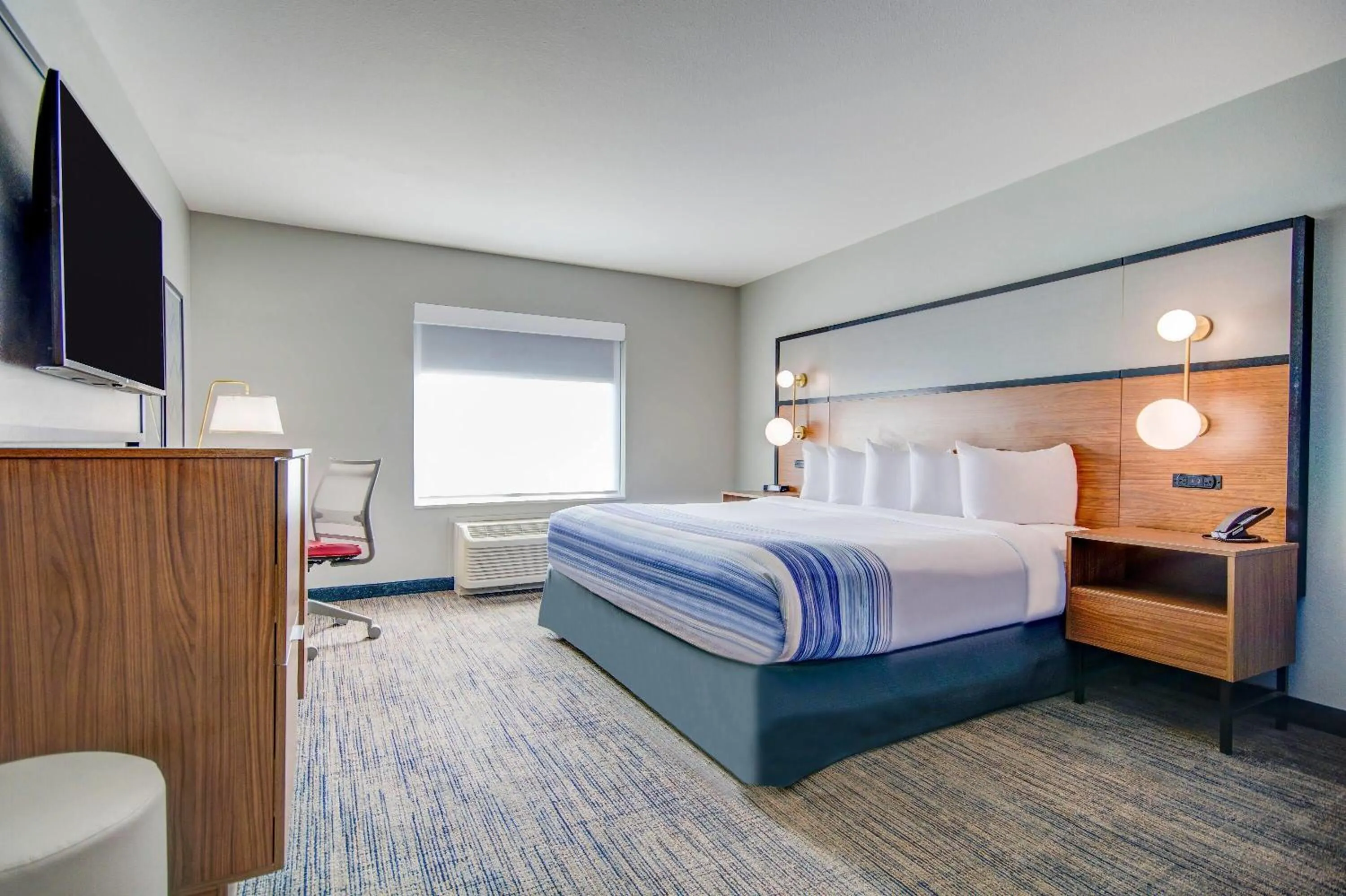 Bed in AmericInn by Wyndham International Falls