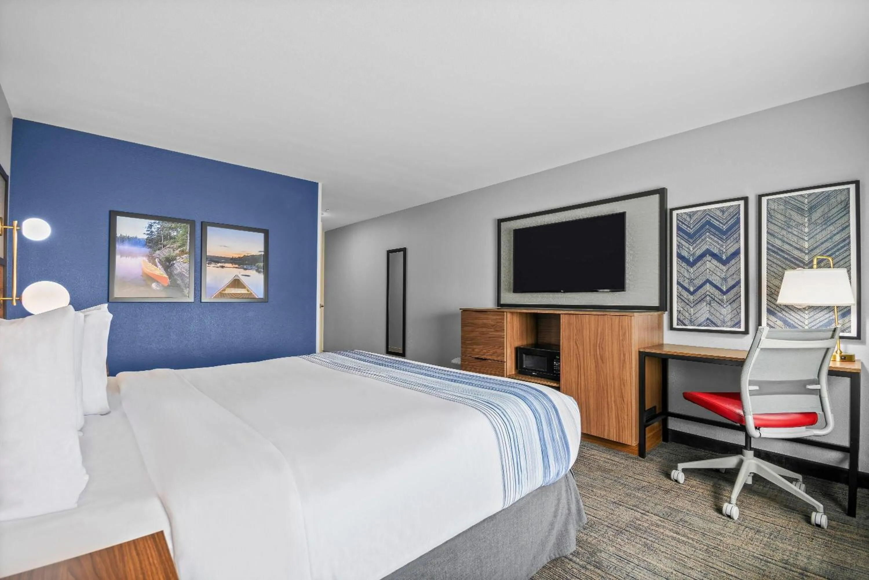 Bed in AmericInn by Wyndham International Falls