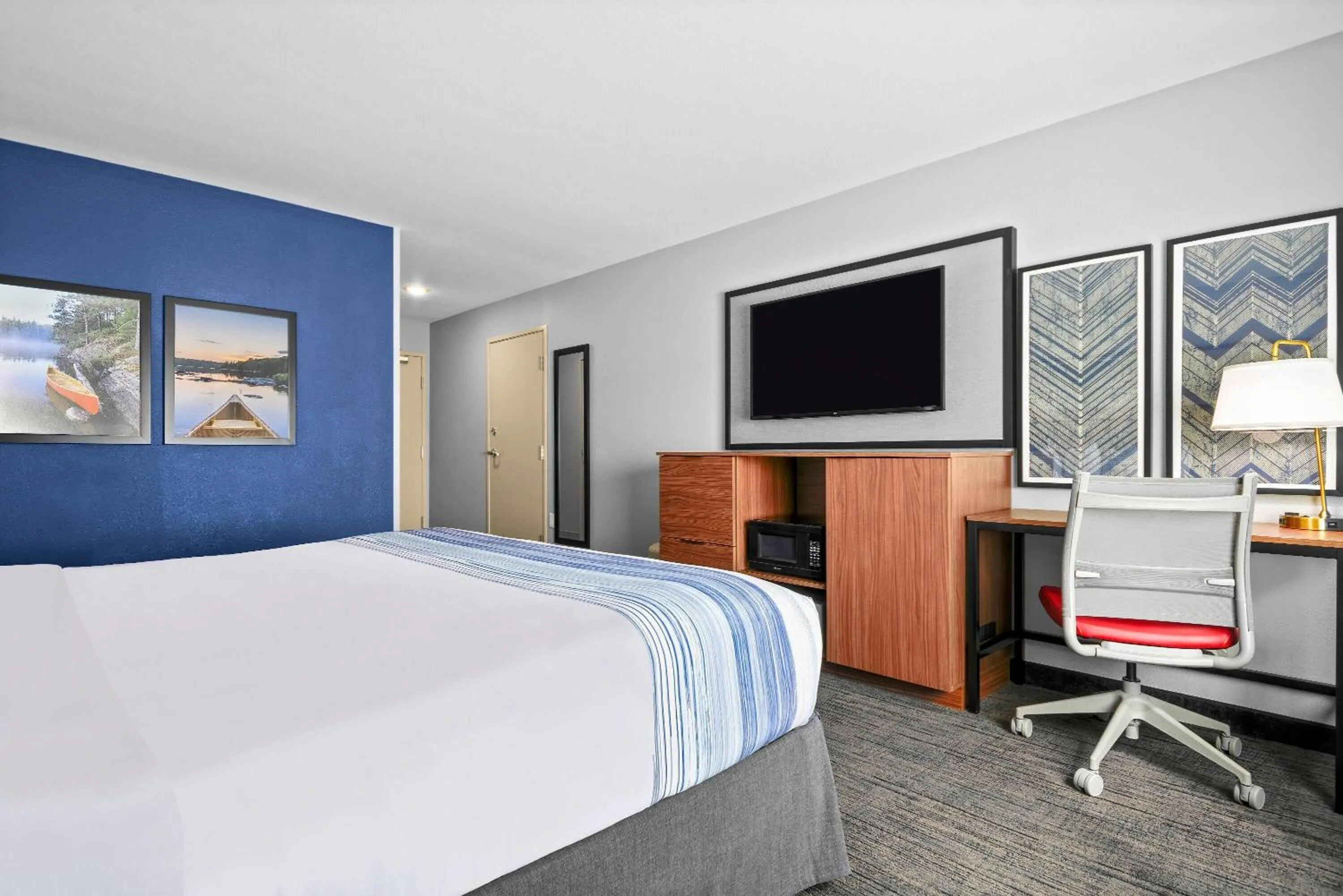 Bed in AmericInn by Wyndham International Falls