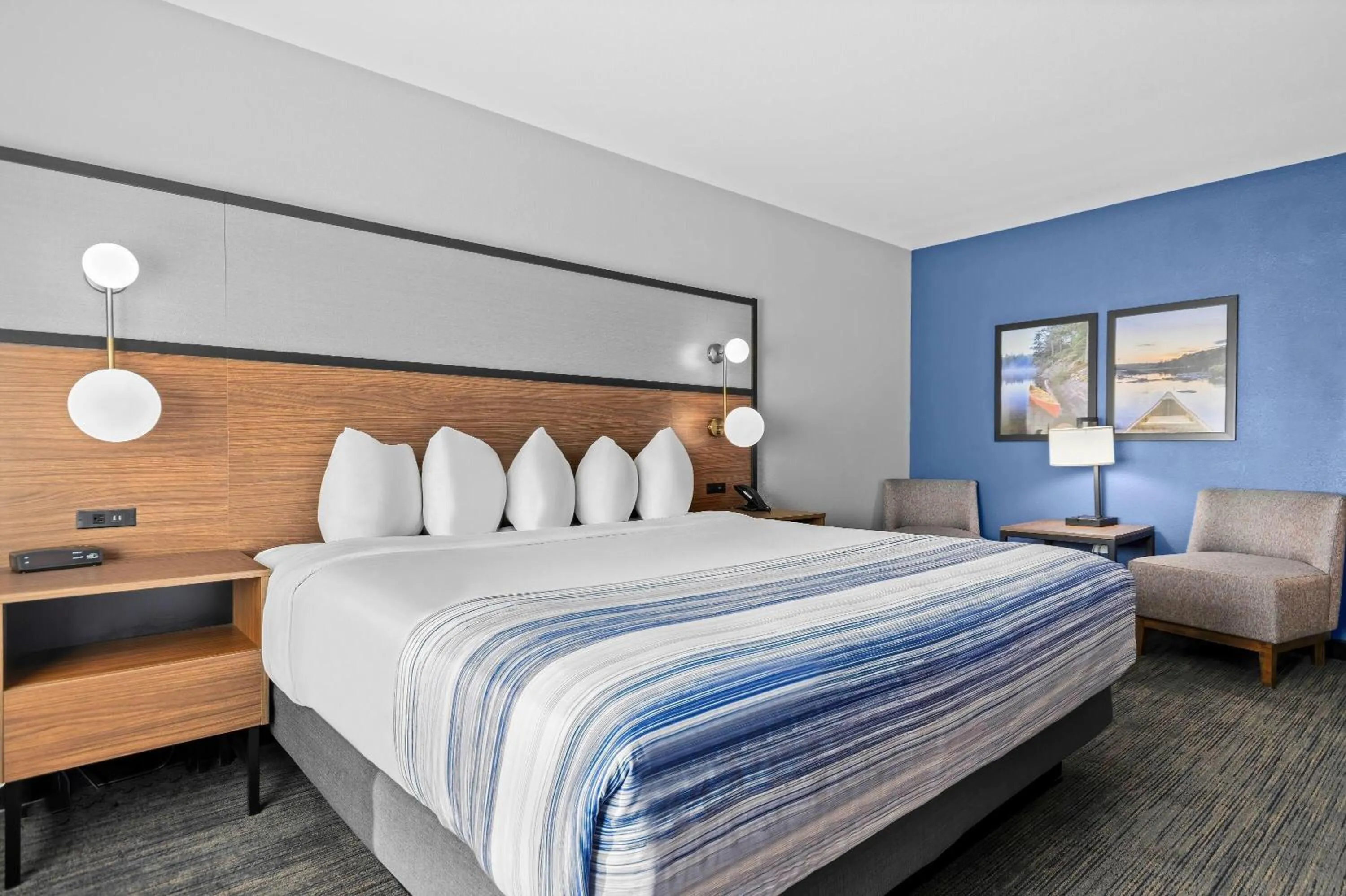 Bed in AmericInn by Wyndham International Falls