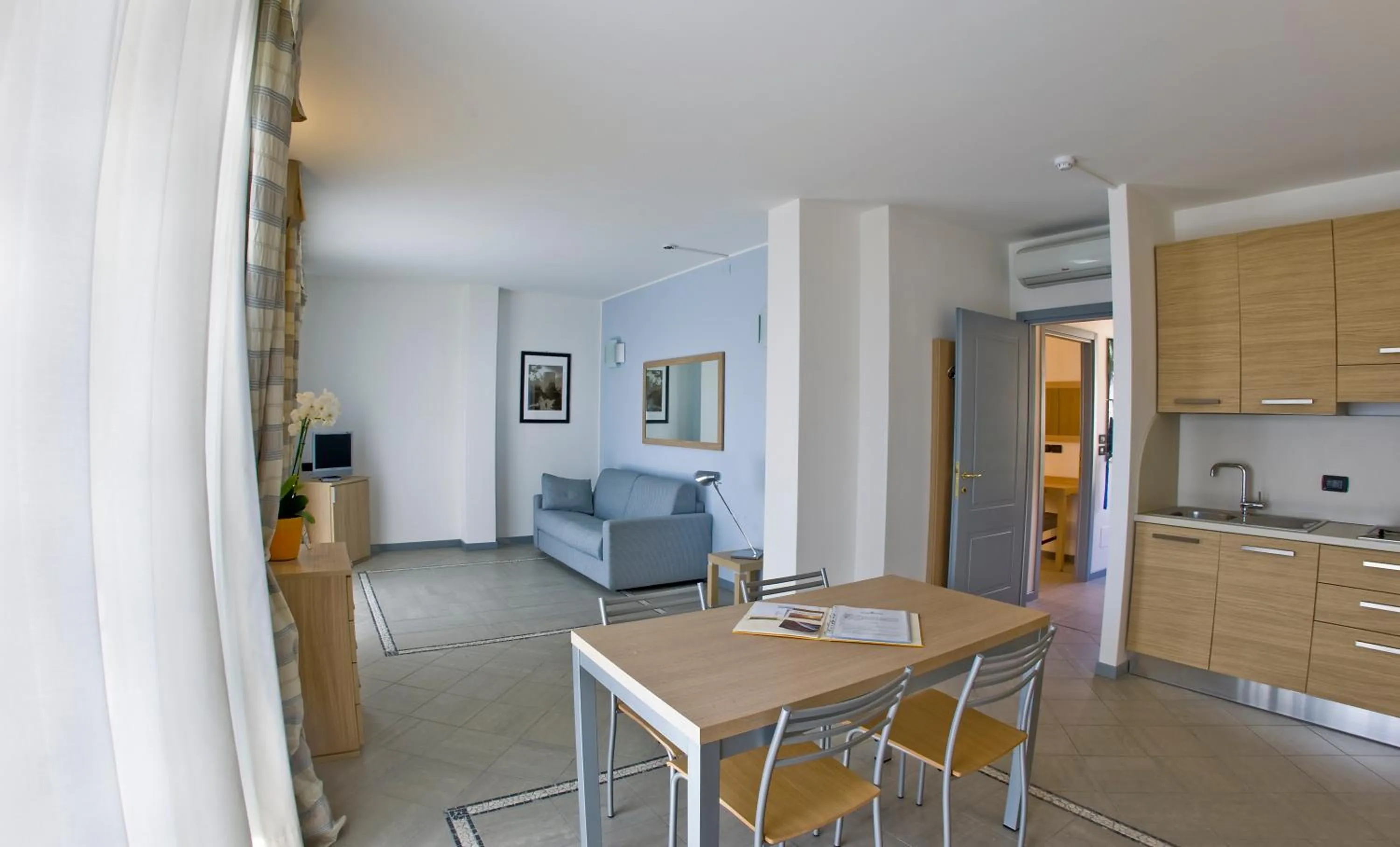 Kitchen or kitchenette in Aregai Marina Hotel & Residence