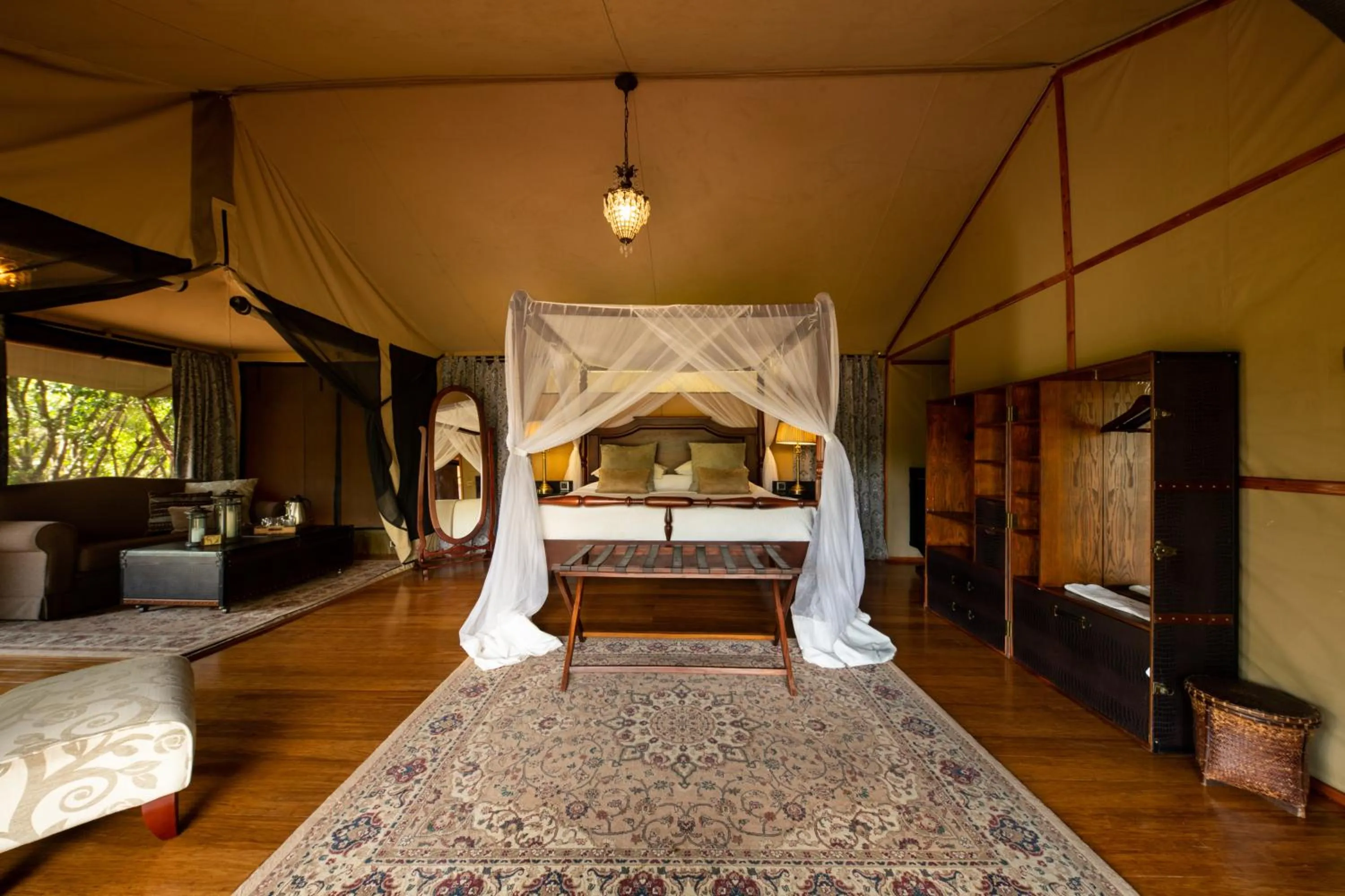 Photo of the whole room, Bed in Elewana Sand River Mara