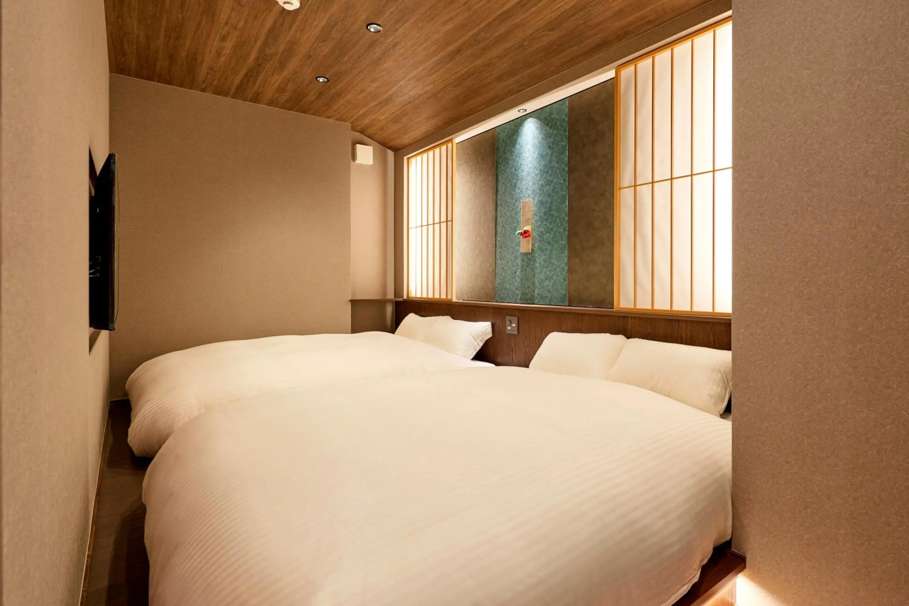 Bedroom, Bed in 古今 天下茶屋 with a private parking lot and a half open-air bath and direct to KIX