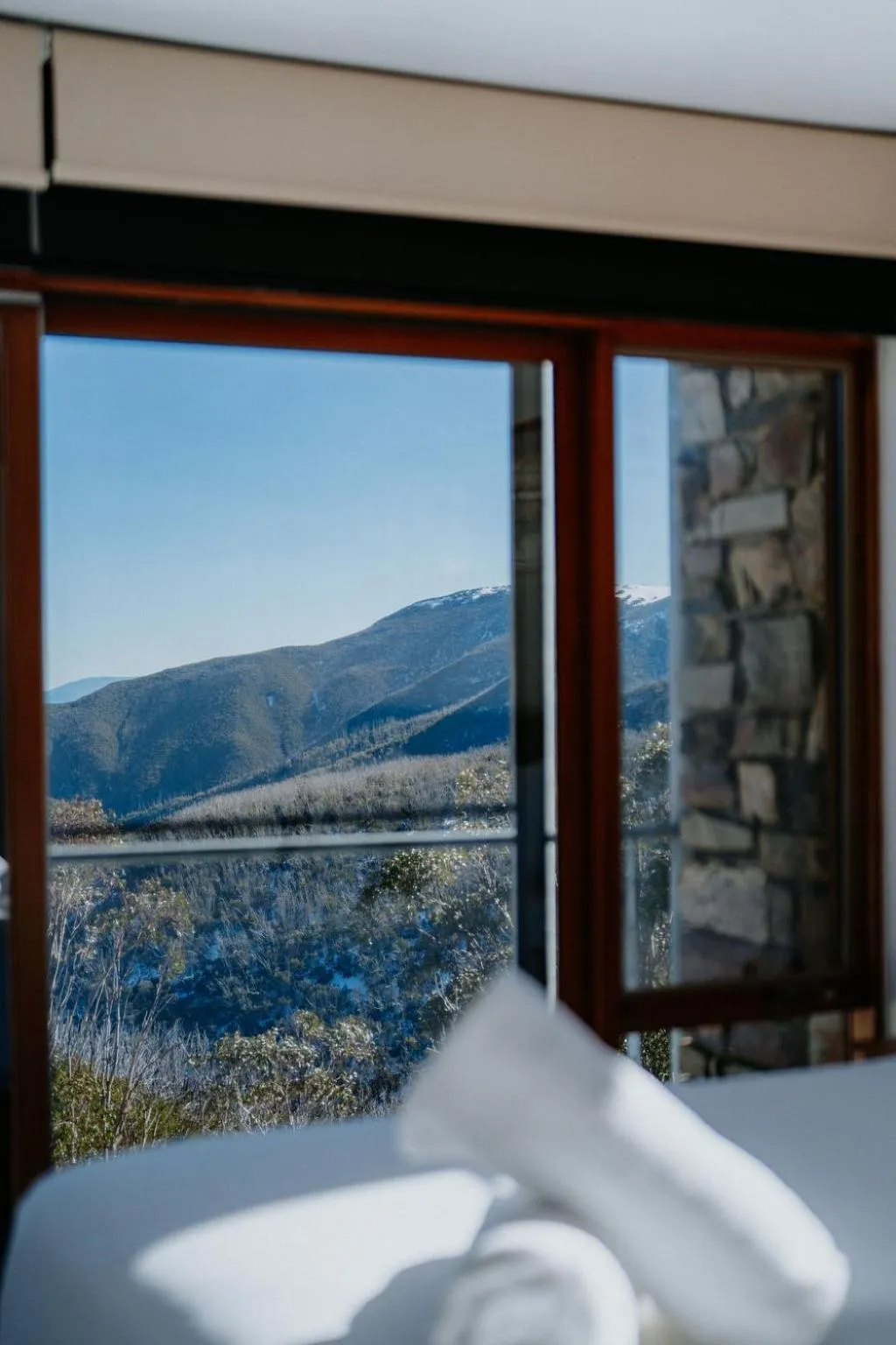 Bed in Alpine Woodsmoke Apartments