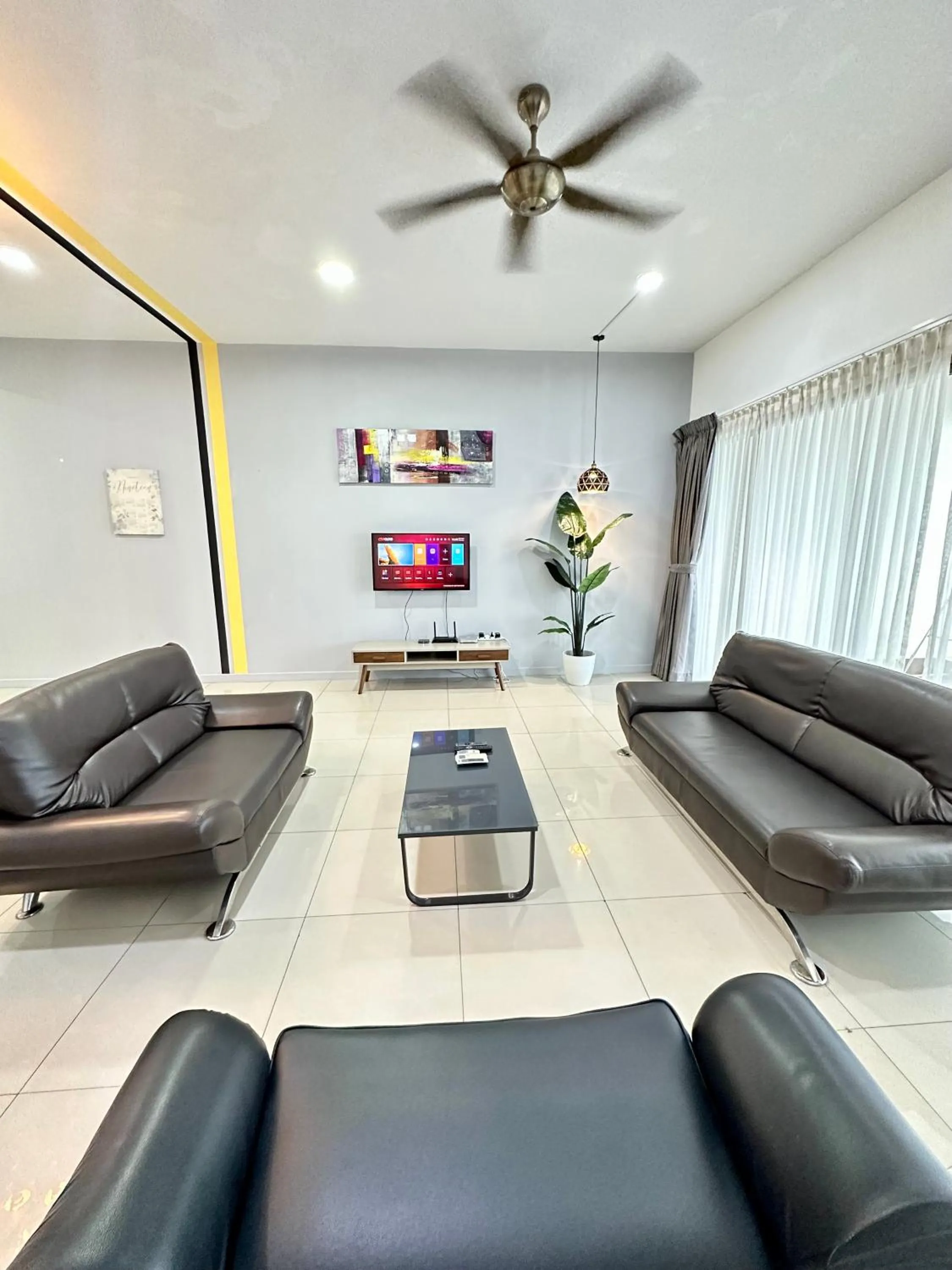 Communal lounge/ TV room in AJ Suites @ Loft Imago KK