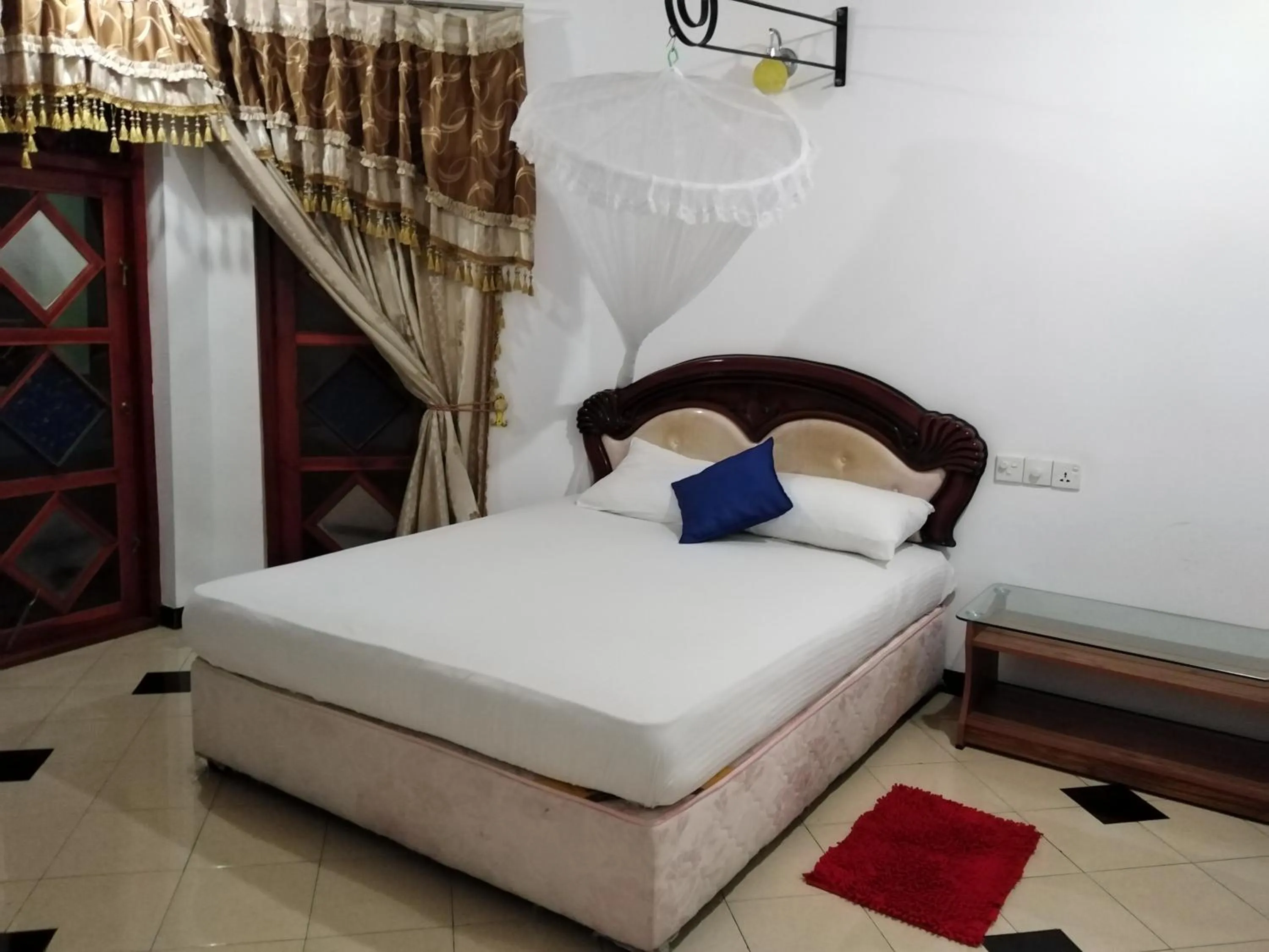 Bed in Peacock Reach Hotel