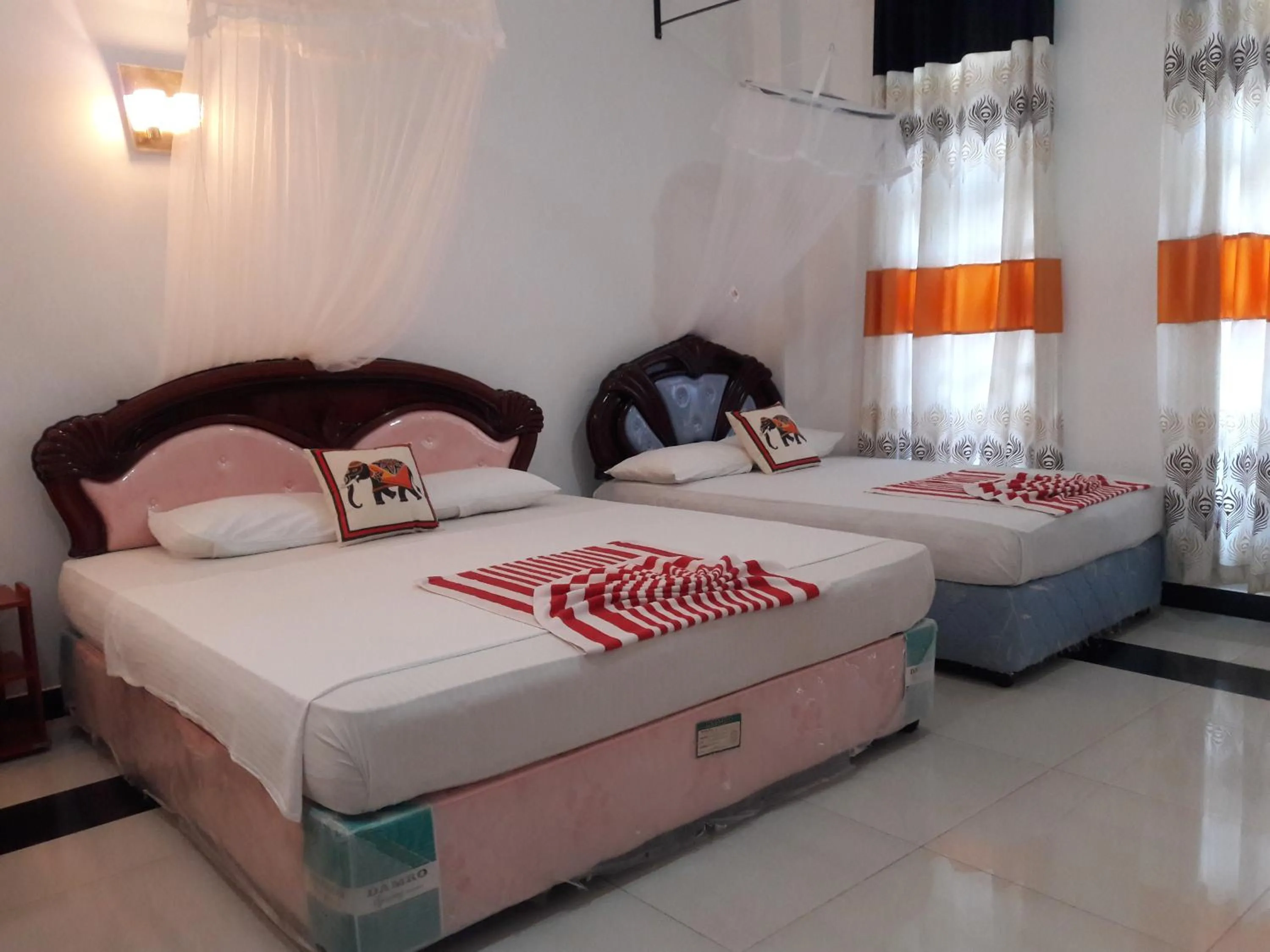 Bed in Peacock Reach Hotel