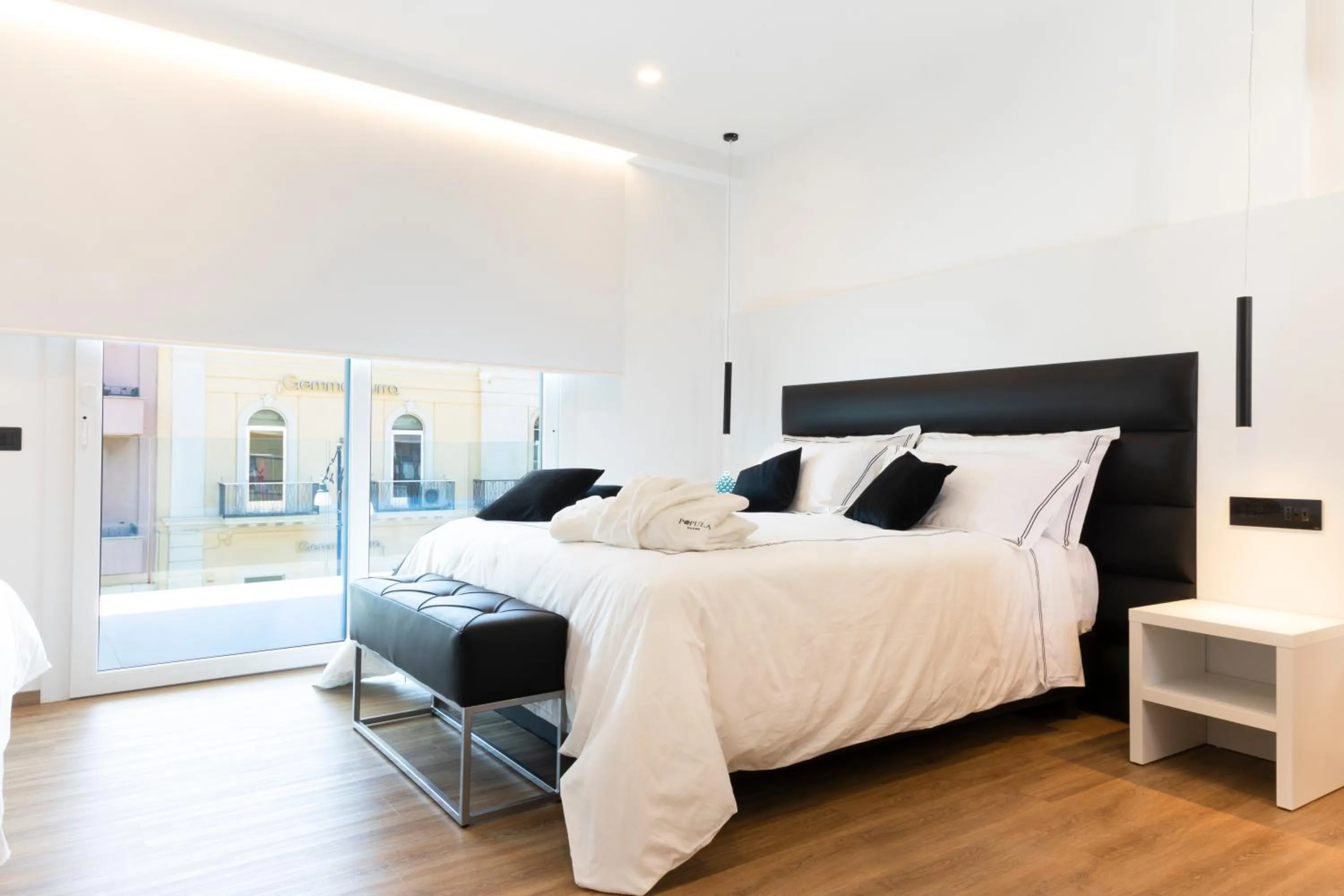 Bed in Popula Rooms & Mediterranean Bay