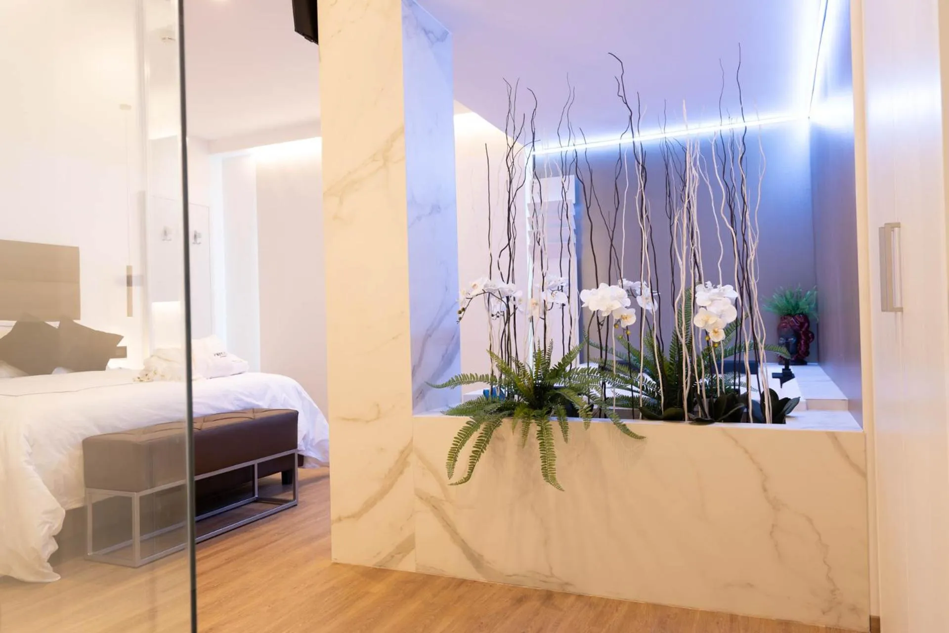 Bed in Popula Rooms & Mediterranean Bay