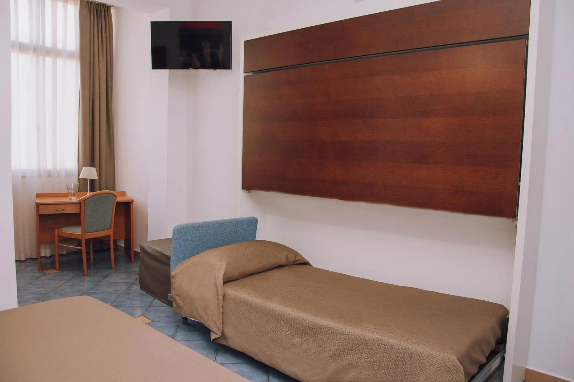 Bed in Hotel Piccolo Sogno