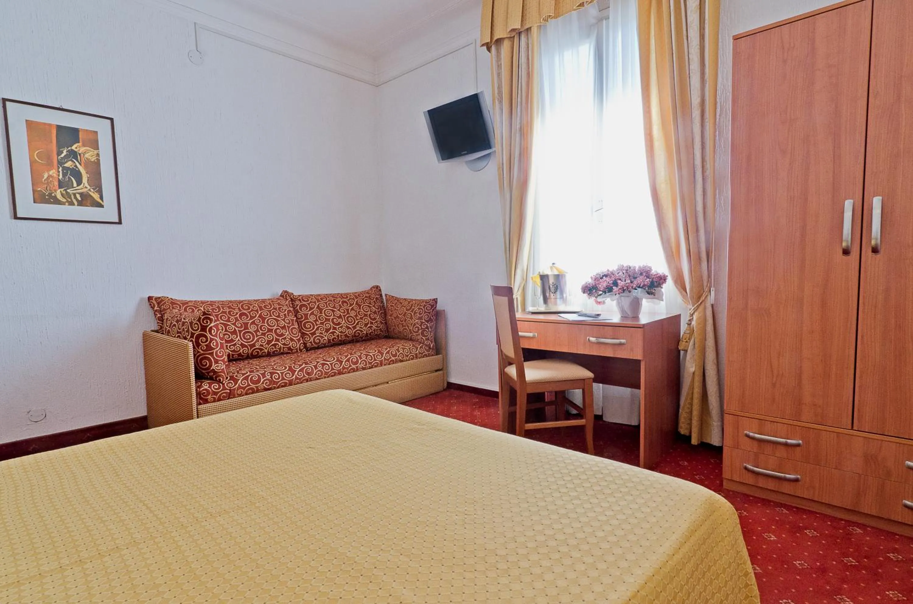 Bed in Hotel Ariston Montecarlo