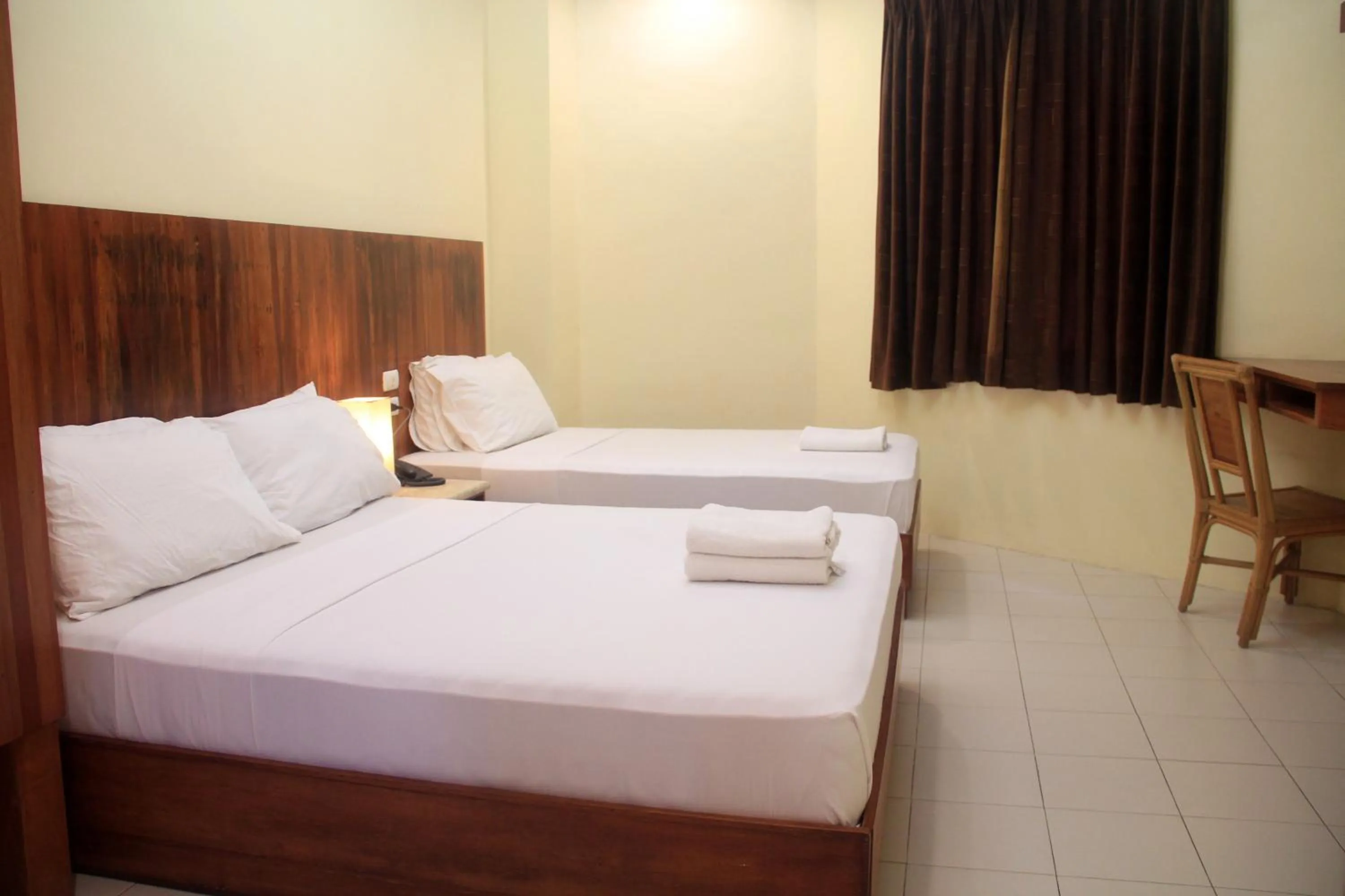 Bed in Tsai Hotel and Residences