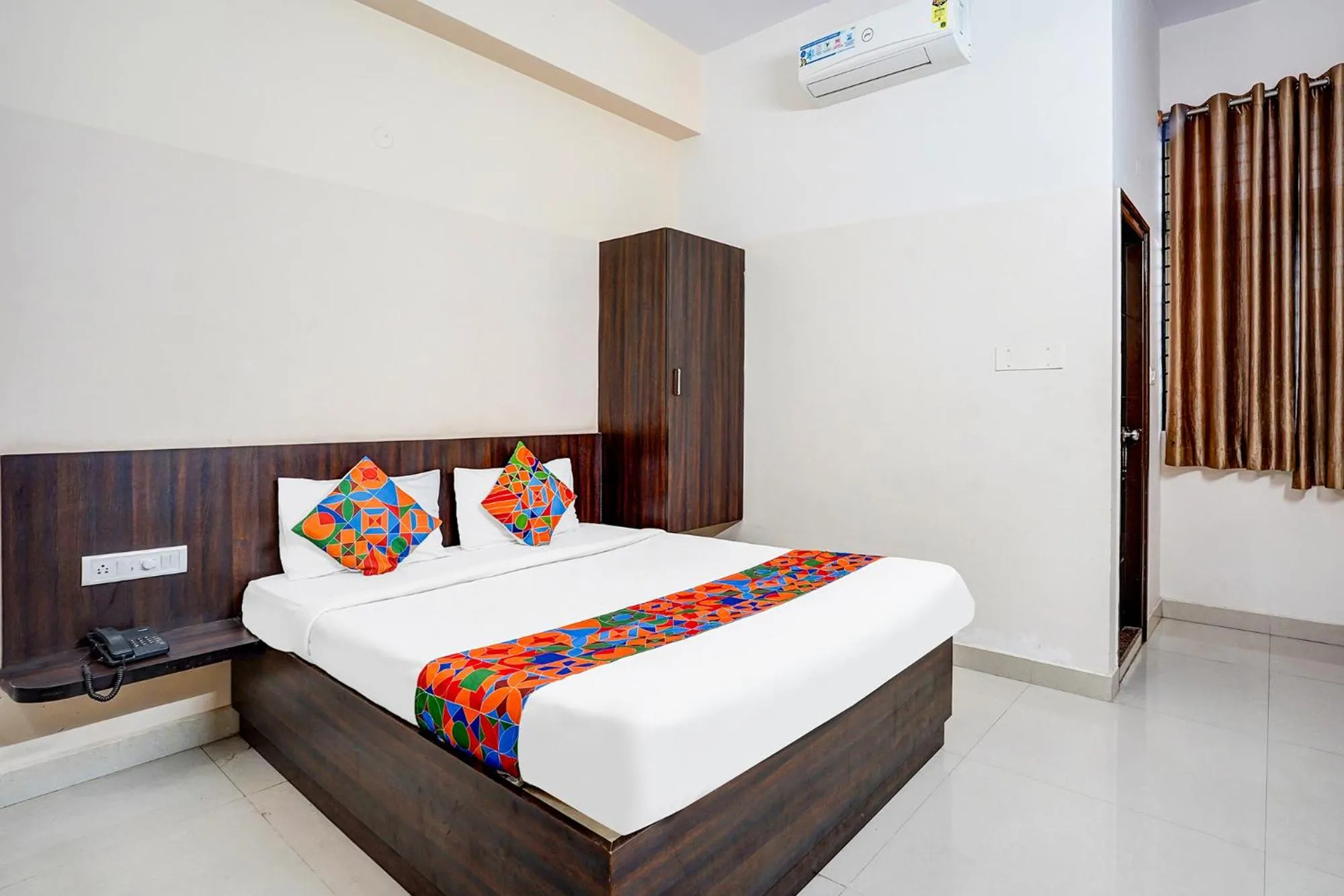 Bed in FabHotel Pride Image - Rajarajeshwari Nagar