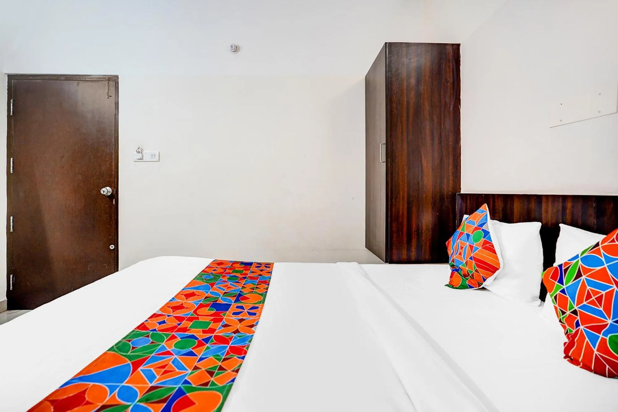 Bed in FabHotel Pride Image - Rajarajeshwari Nagar