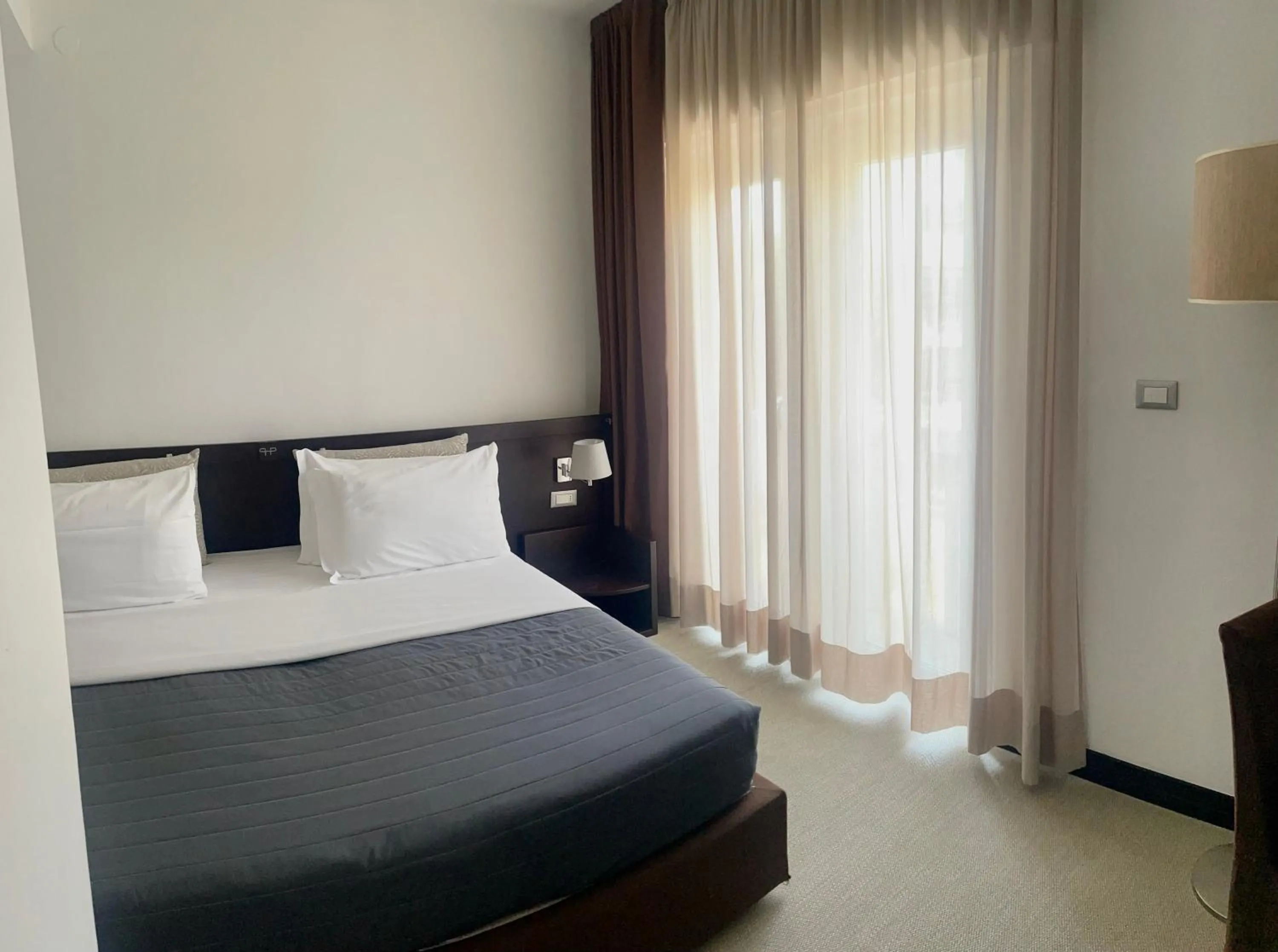 Bed in Hotel Petit Palais