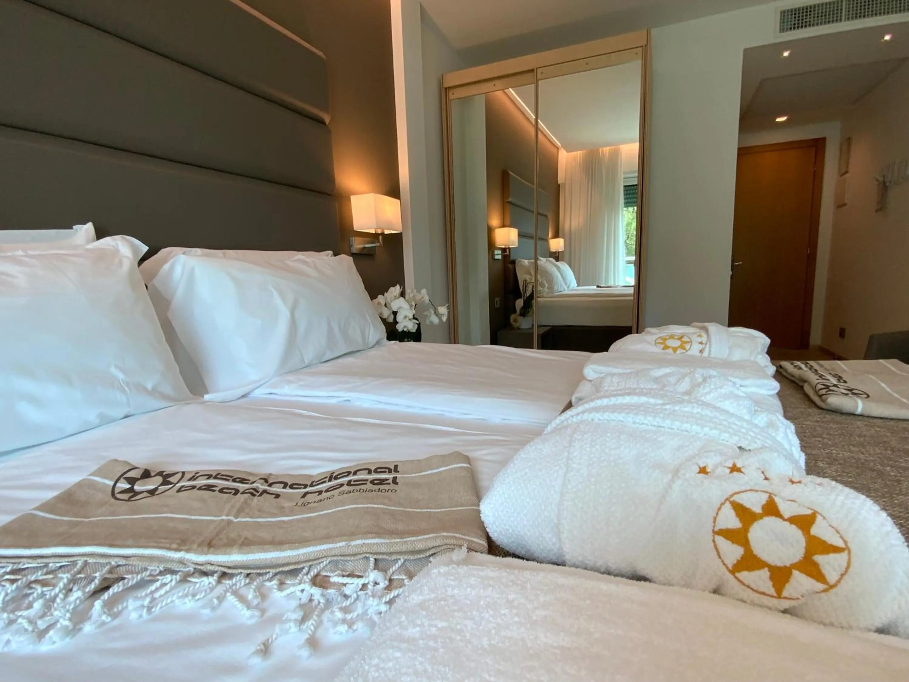 towels, Bed in International Beach Hotel