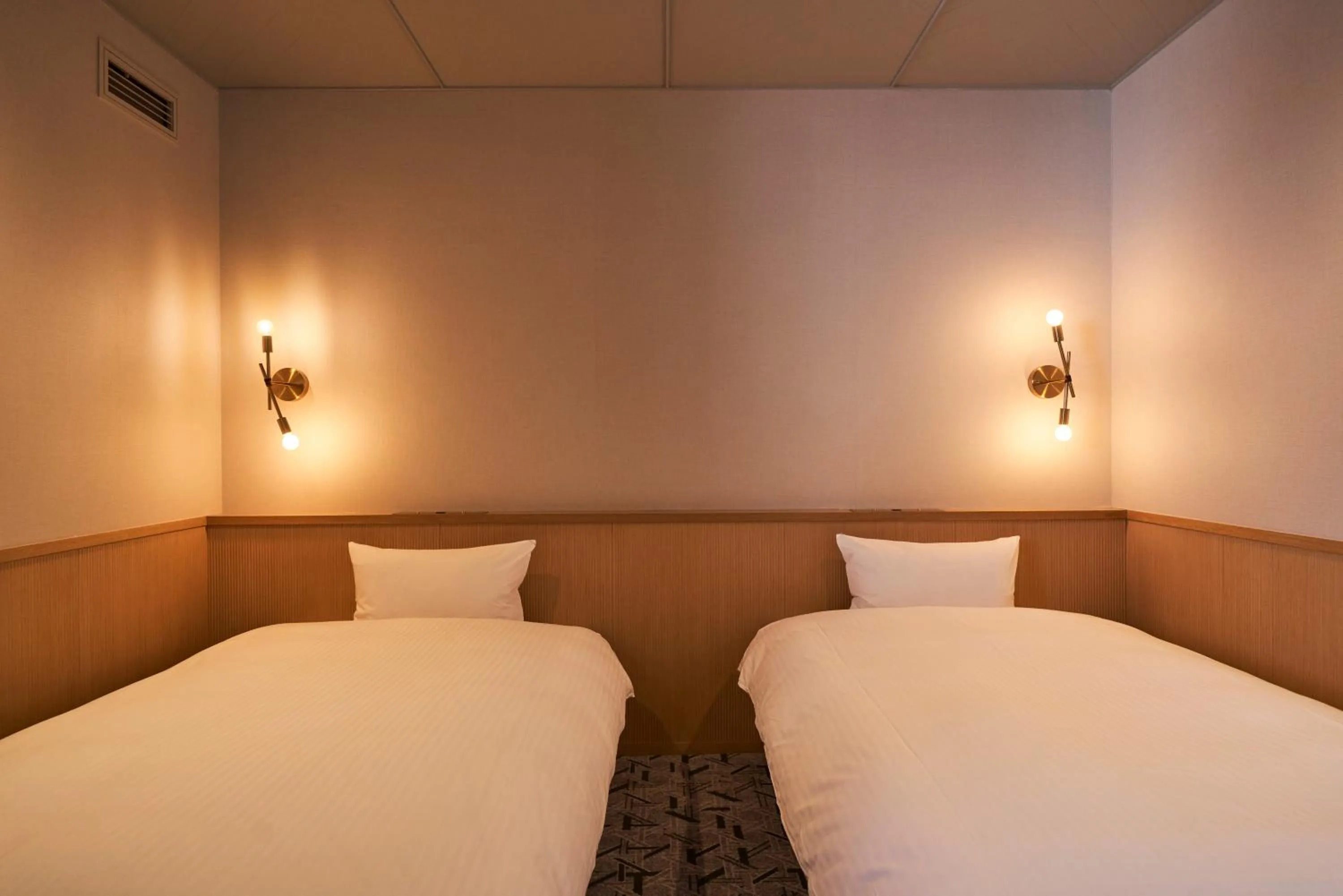 Bed in Mito Sannomaru Hotel