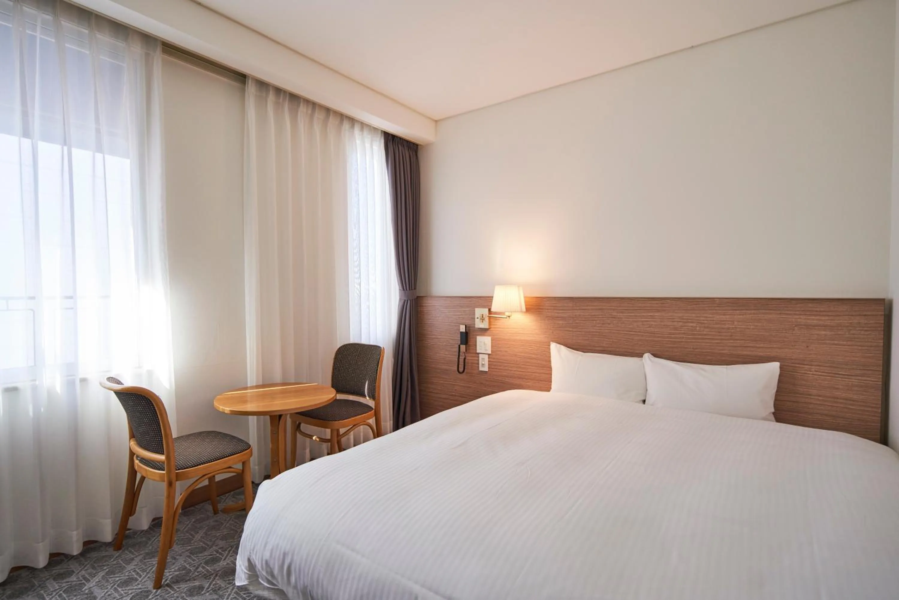 Bed in Mito Sannomaru Hotel