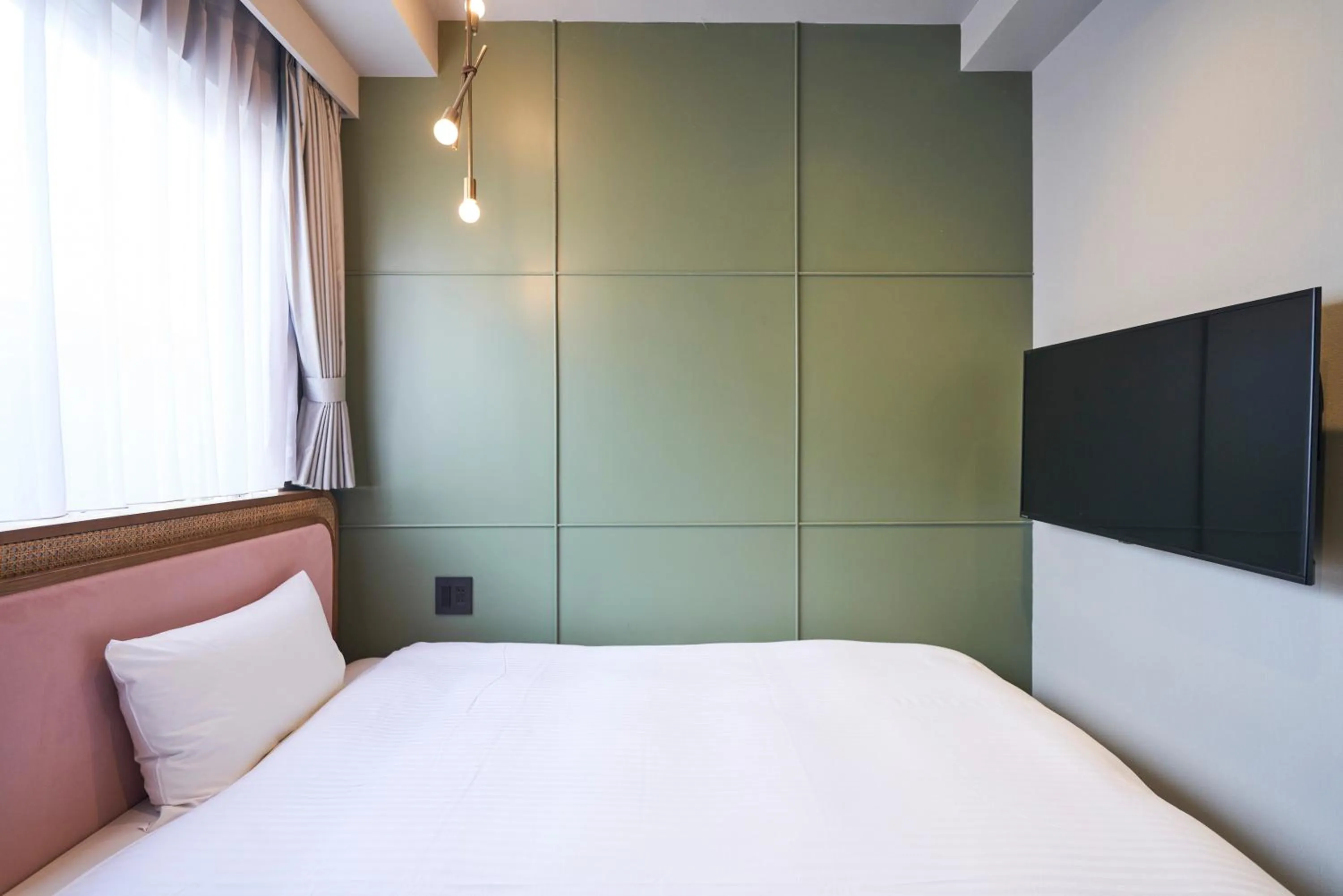 Bed in Mito Sannomaru Hotel