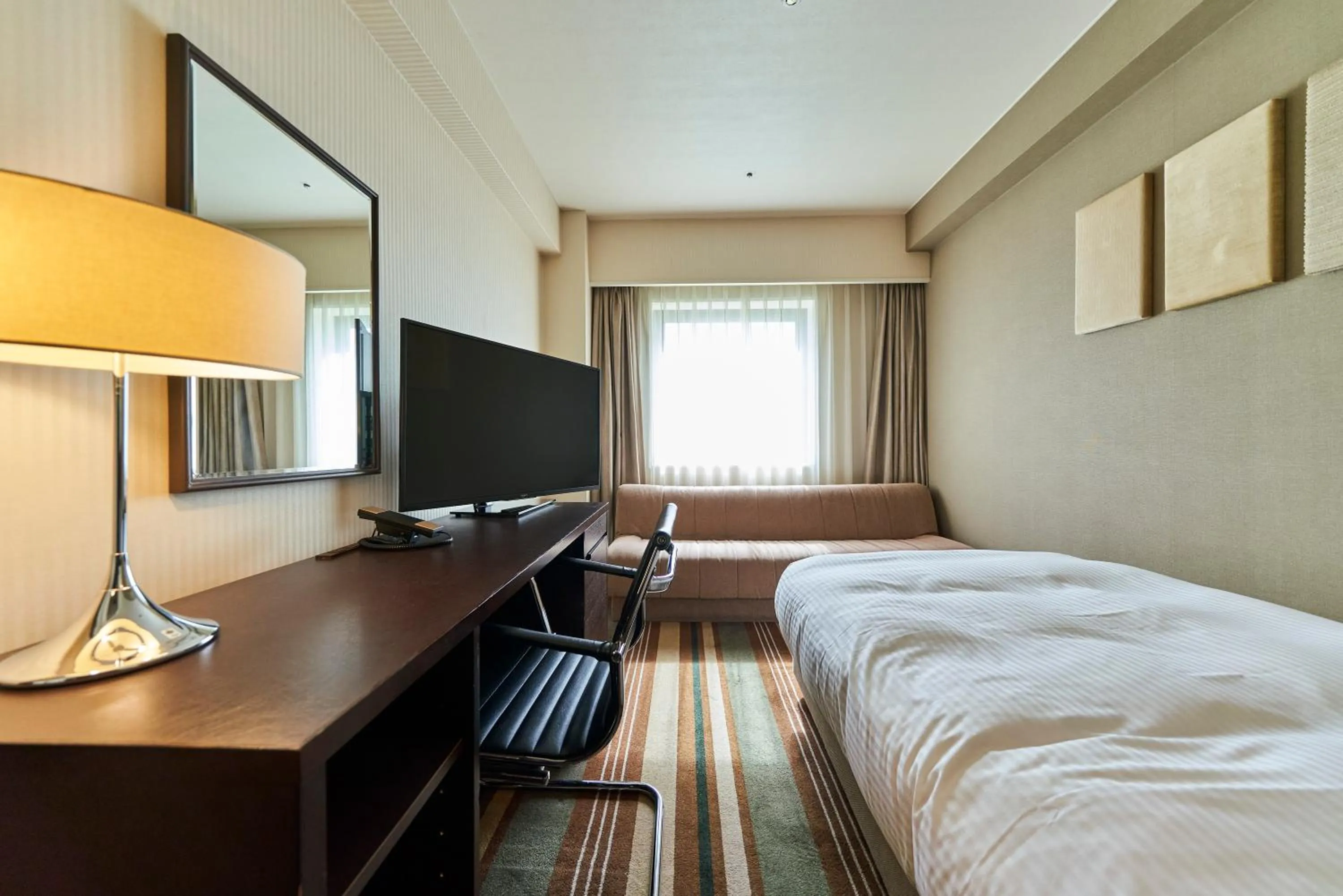 Bed in Saitama Grand Hotel Fukaya