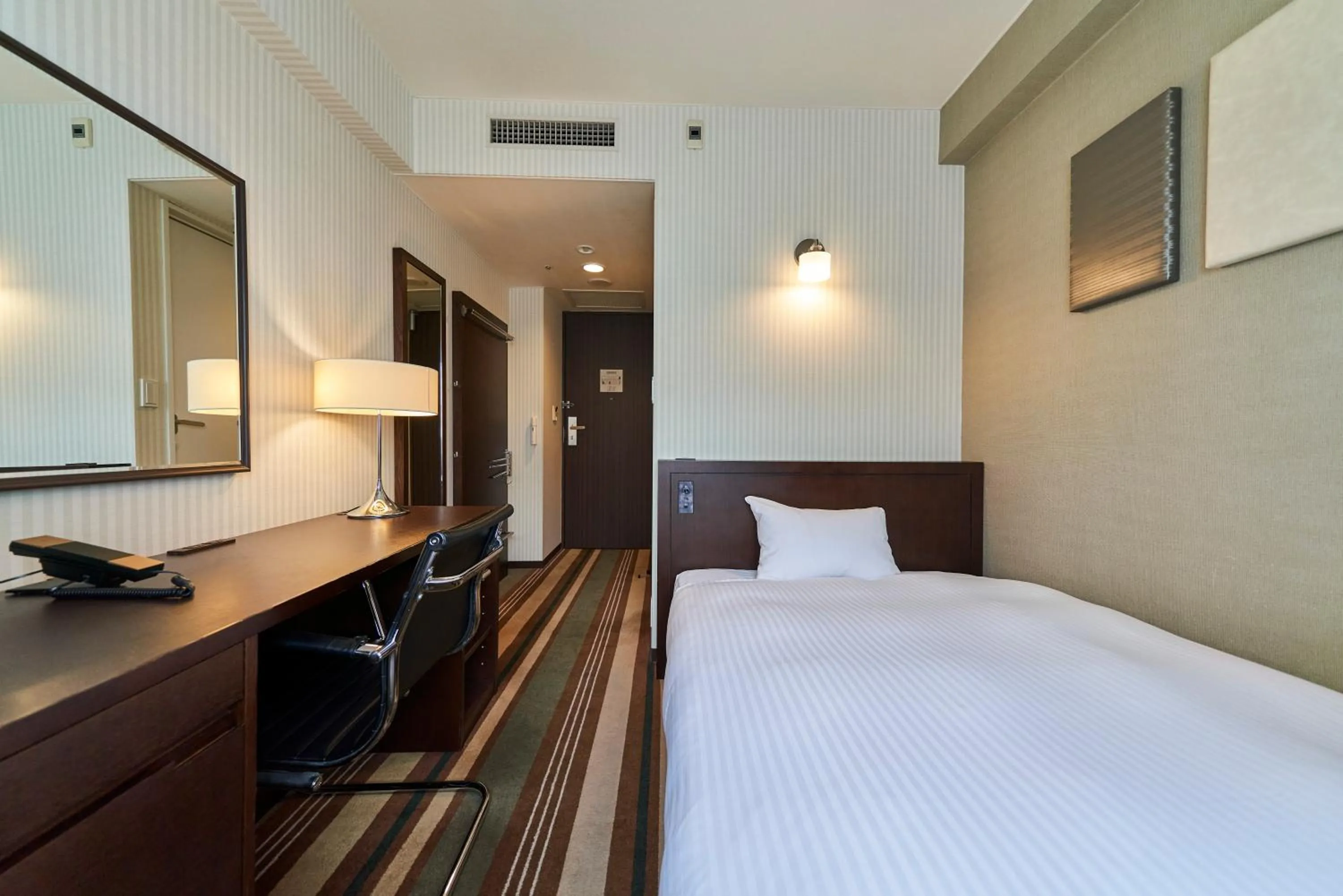 Bed in Saitama Grand Hotel Fukaya