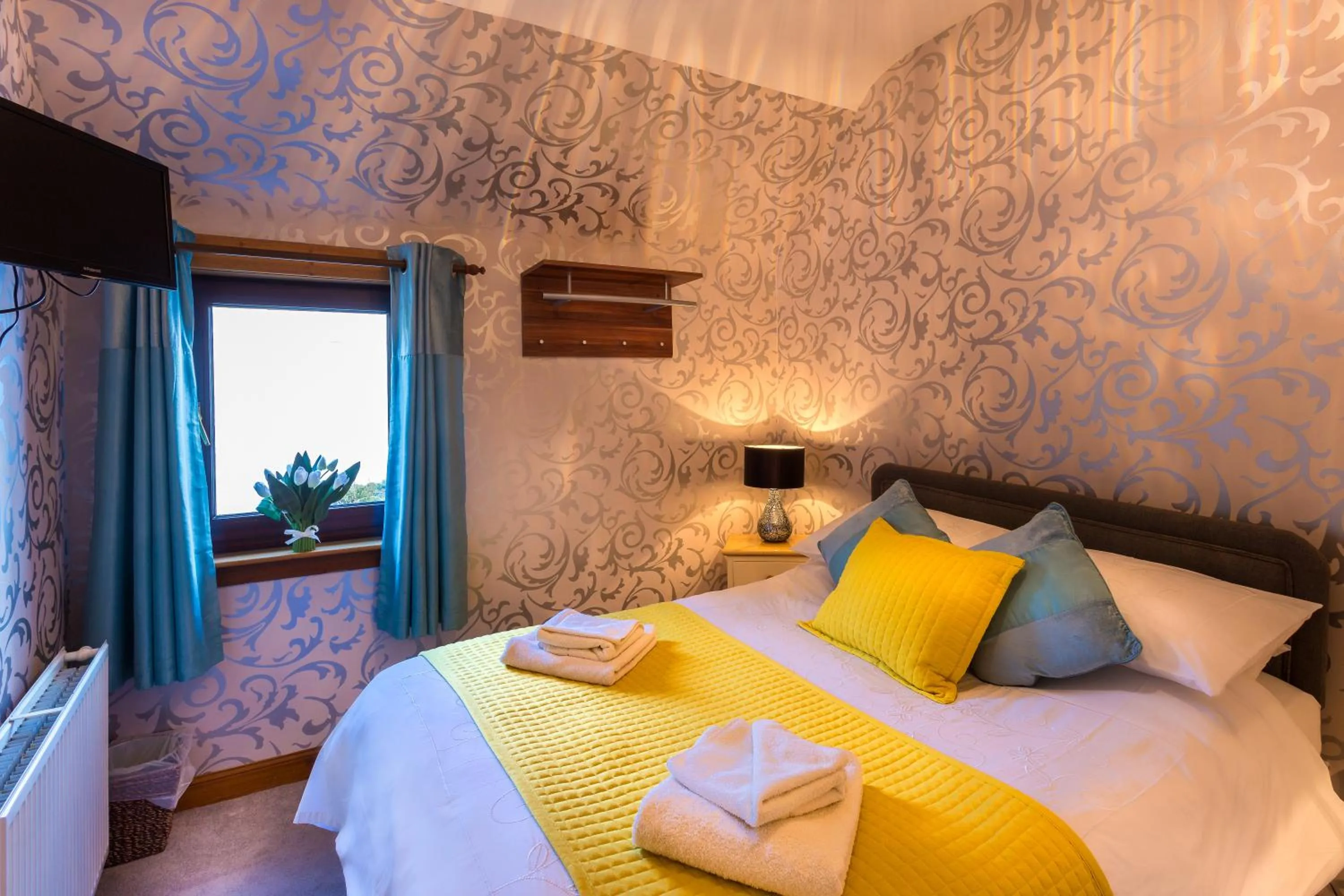 Bed in Neptunes Rest Guest Hotel