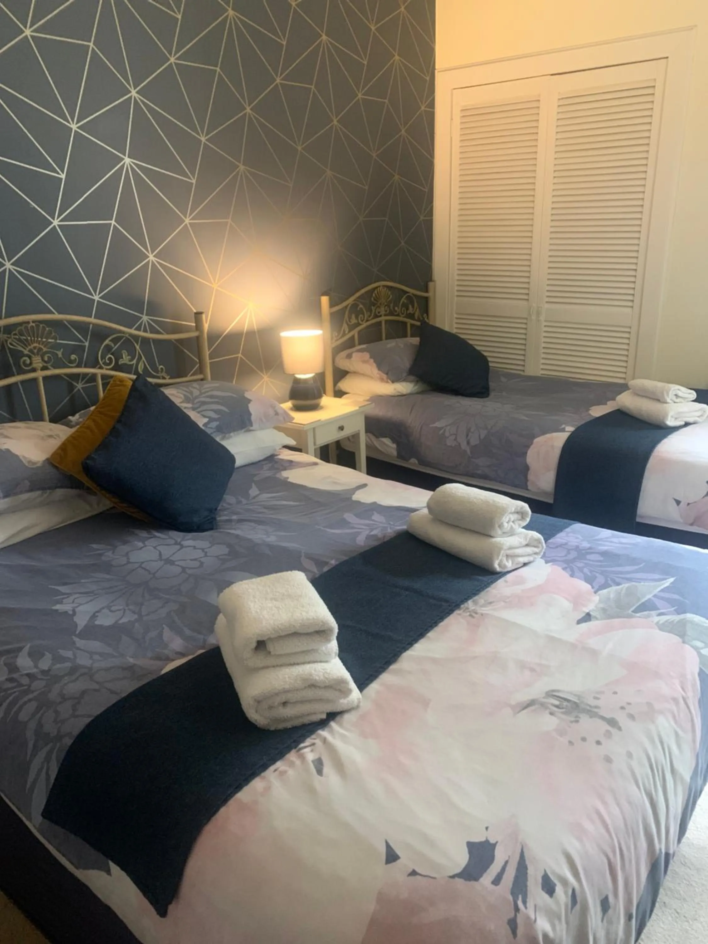 Bed in Neptunes Rest Guest Hotel