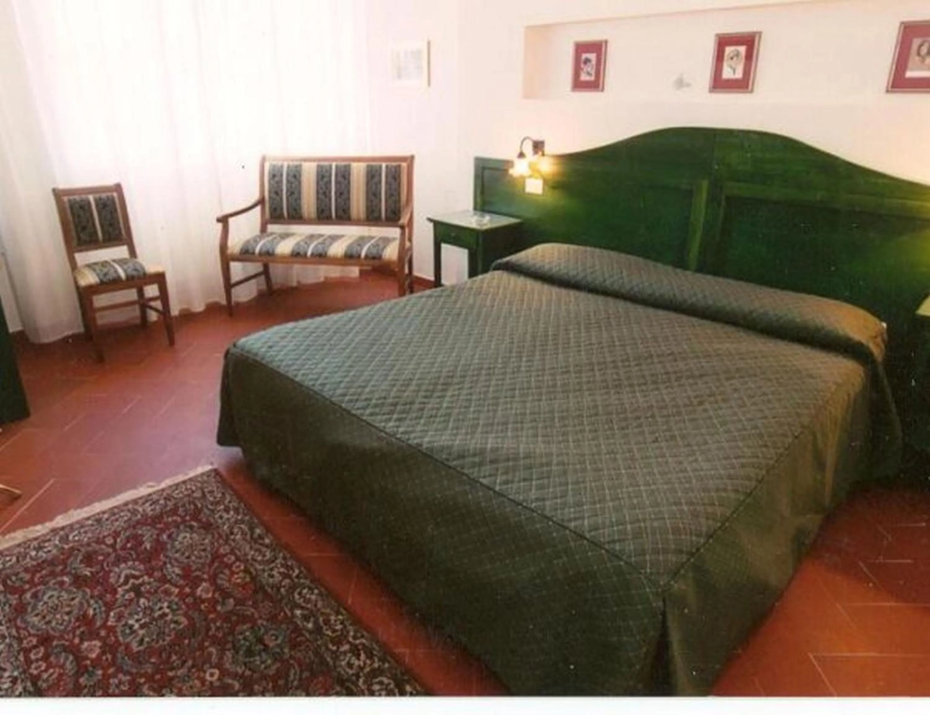 Bed in Hotel Monna Lisa