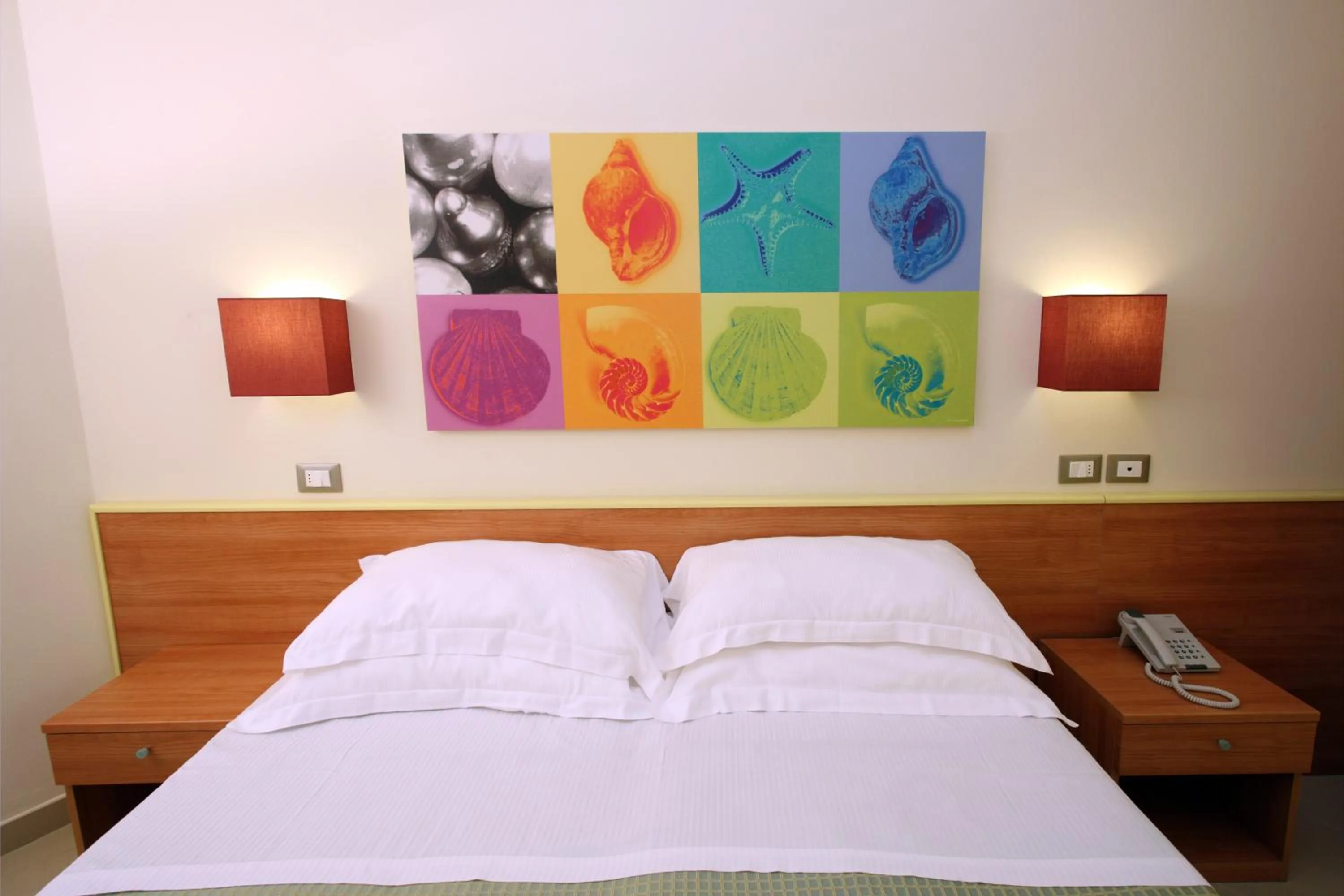 Bed in Noha Suite Hotel