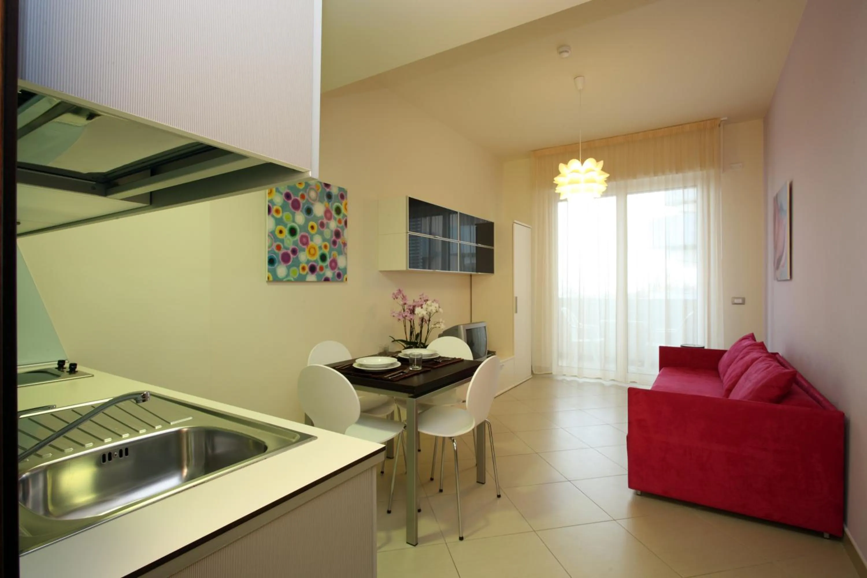 Kitchen or kitchenette in Noha Suite Hotel