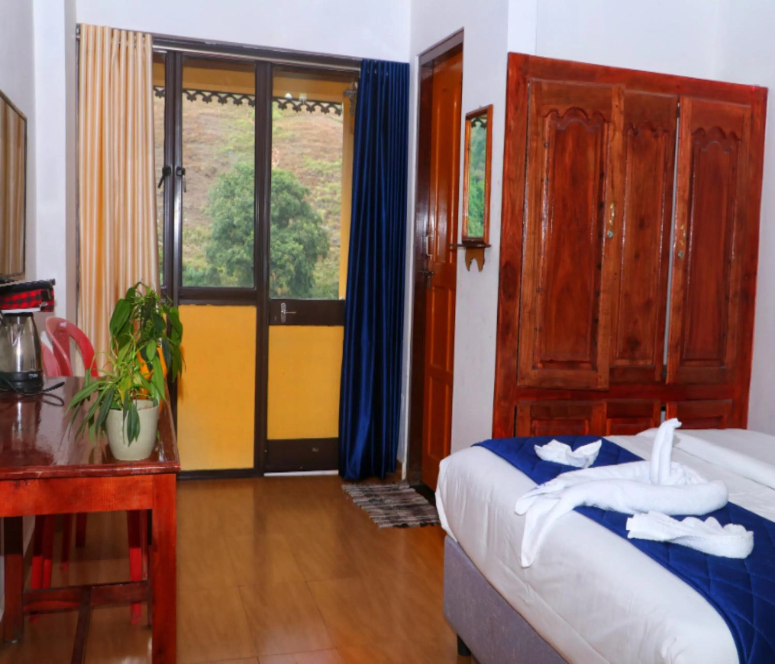 Photo of the whole room, Bed in AC MIST